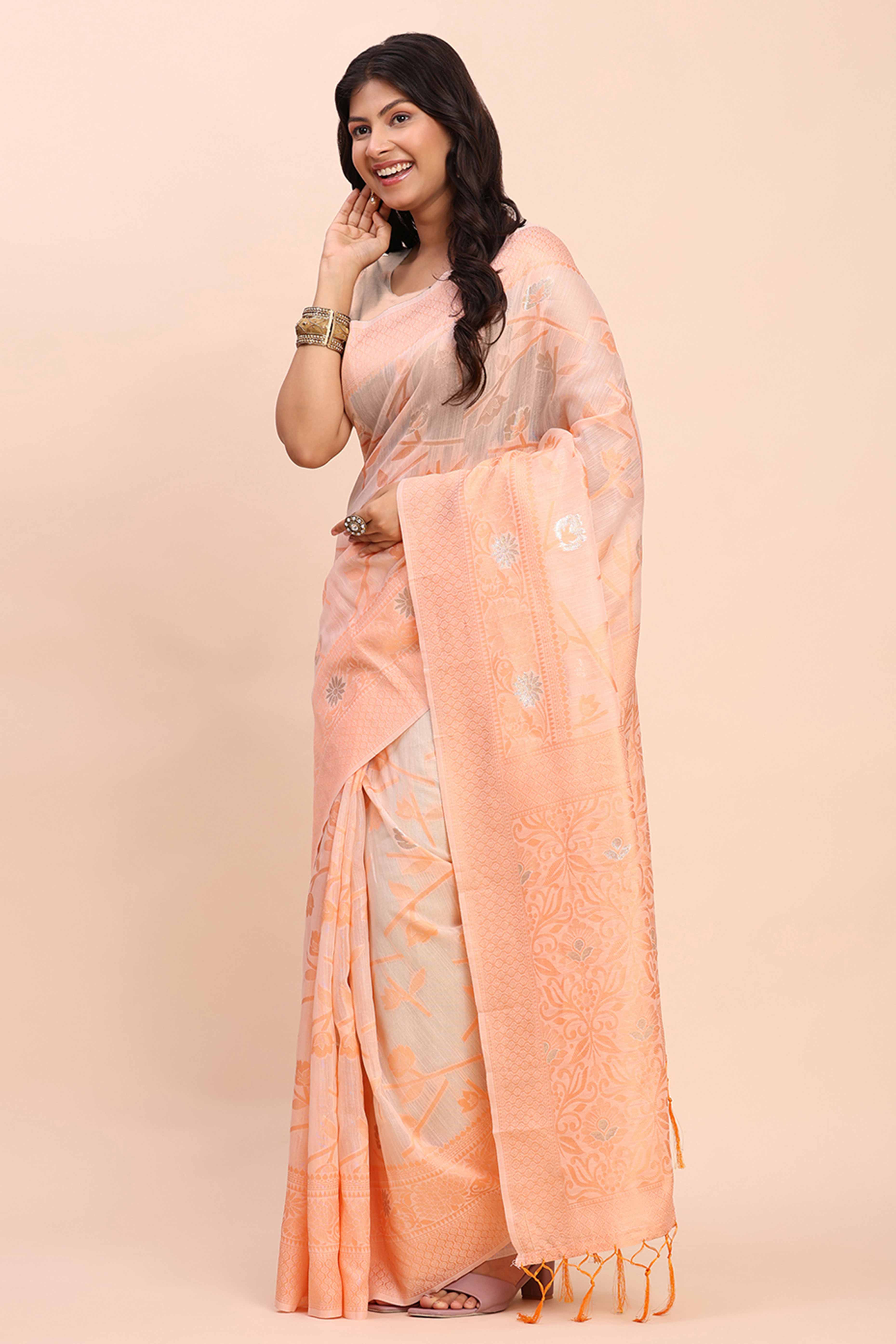 Peach Floral Linen Cotton Saree Accented With Zari Weaving & Tassel Pallu Elegance