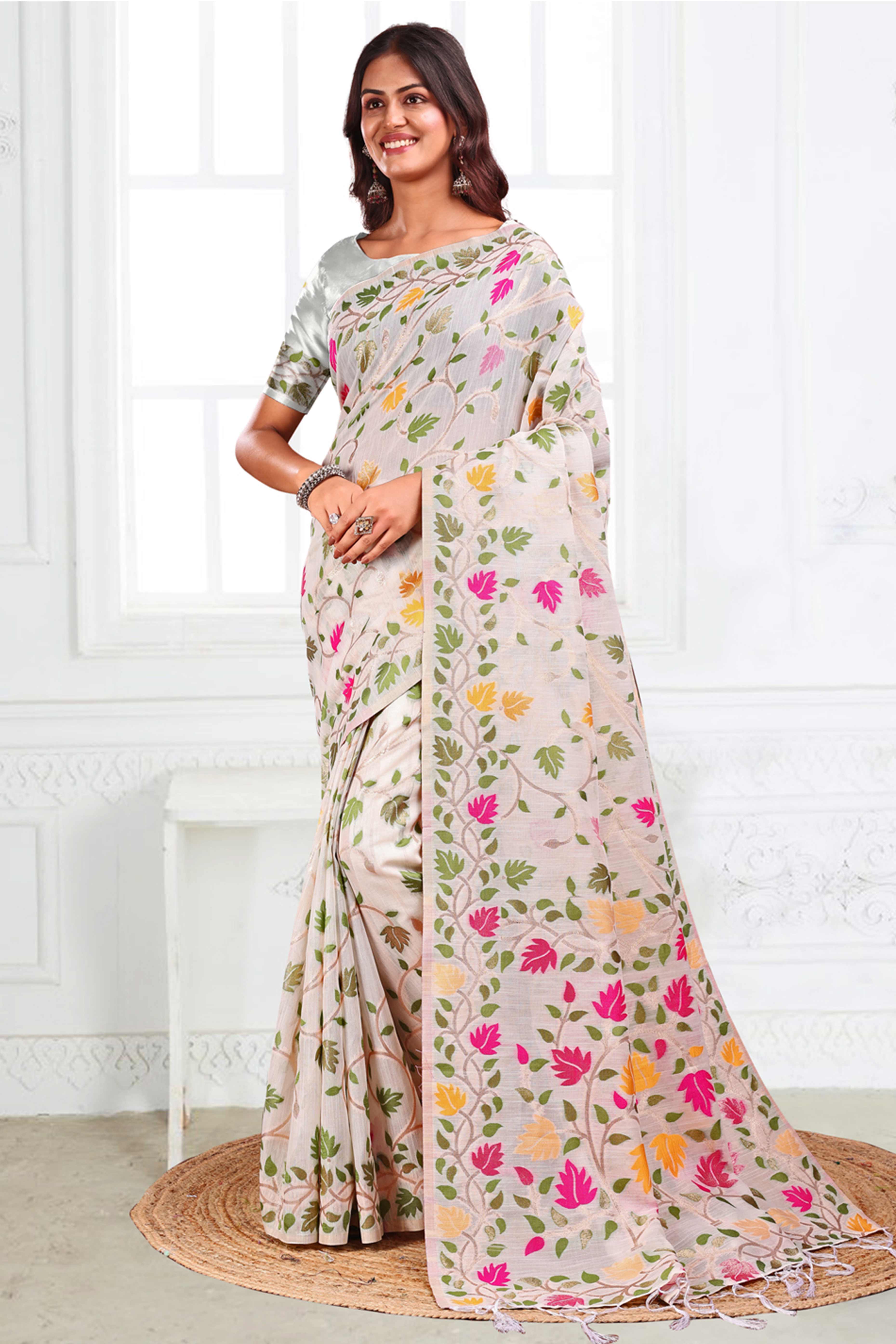 White Linen Cotton Silk  Saree Enhanced With Floral Zari Weaving & Tasselled Pallu Finish