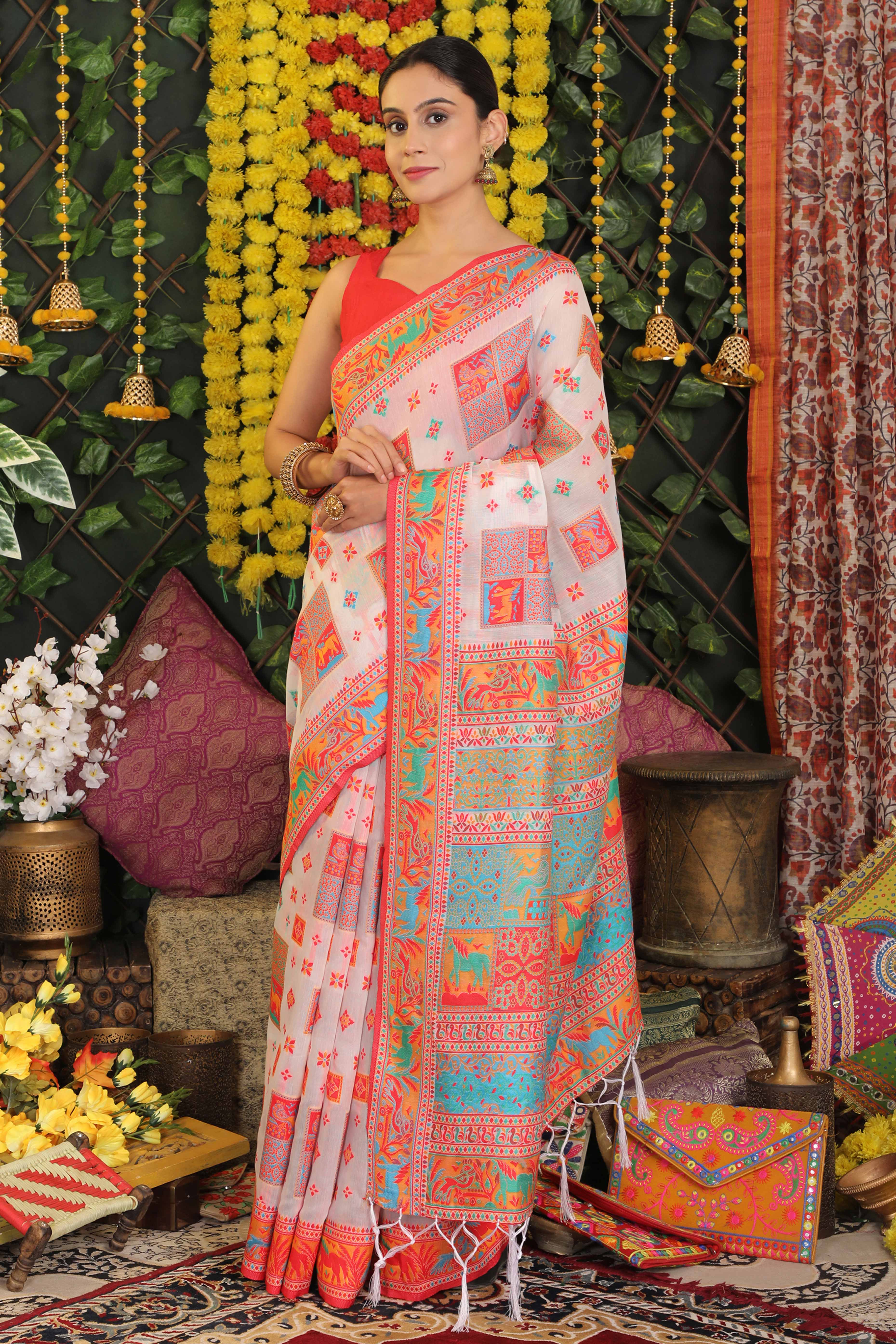 White Linen Cotton Saree Adorned With Floral Zari Weaving & Tassel Pallu