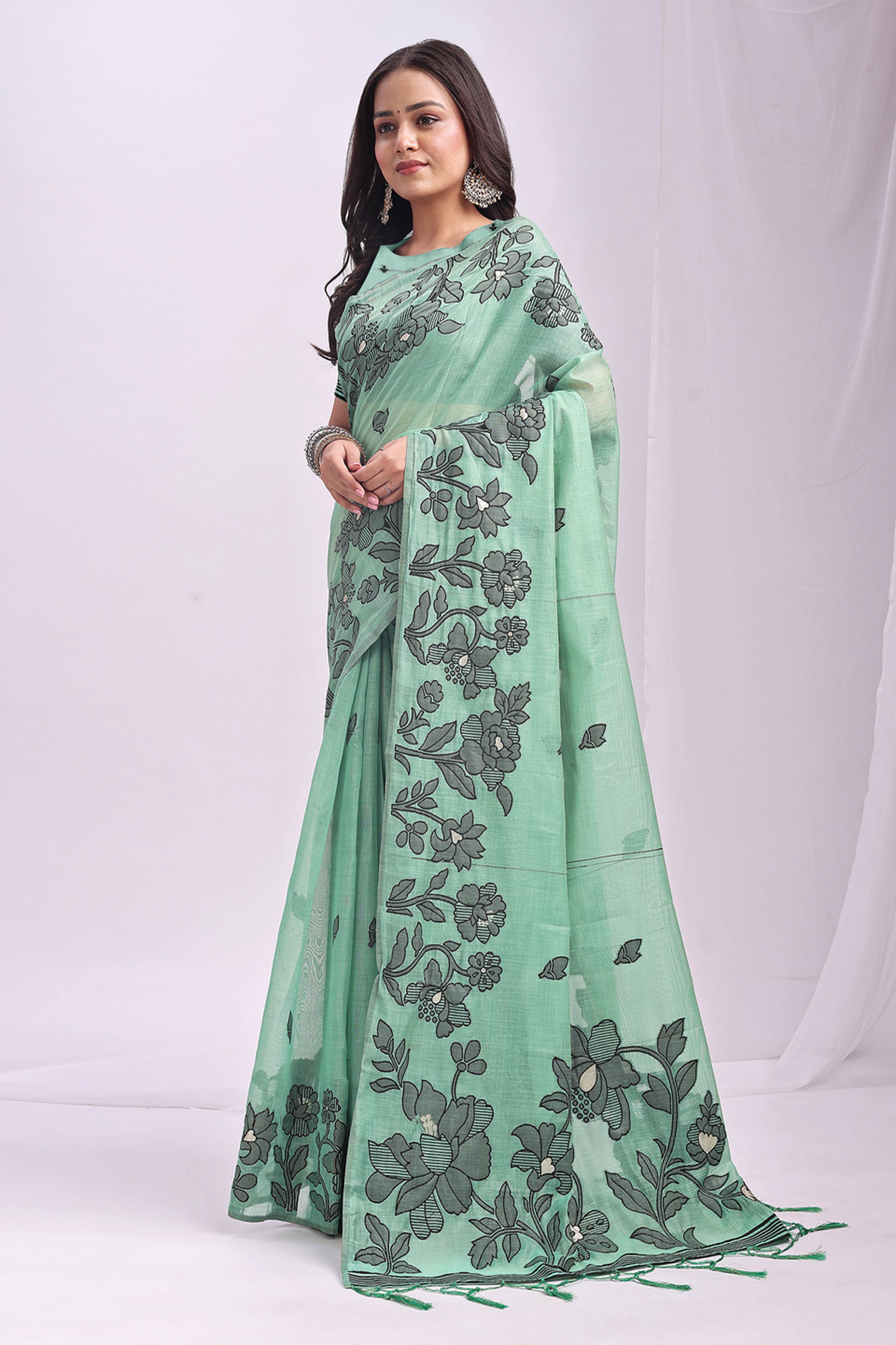 Rama Green Ethnic Saree in a Linen Cotton Blend Adorned with Floral Weave Designs
