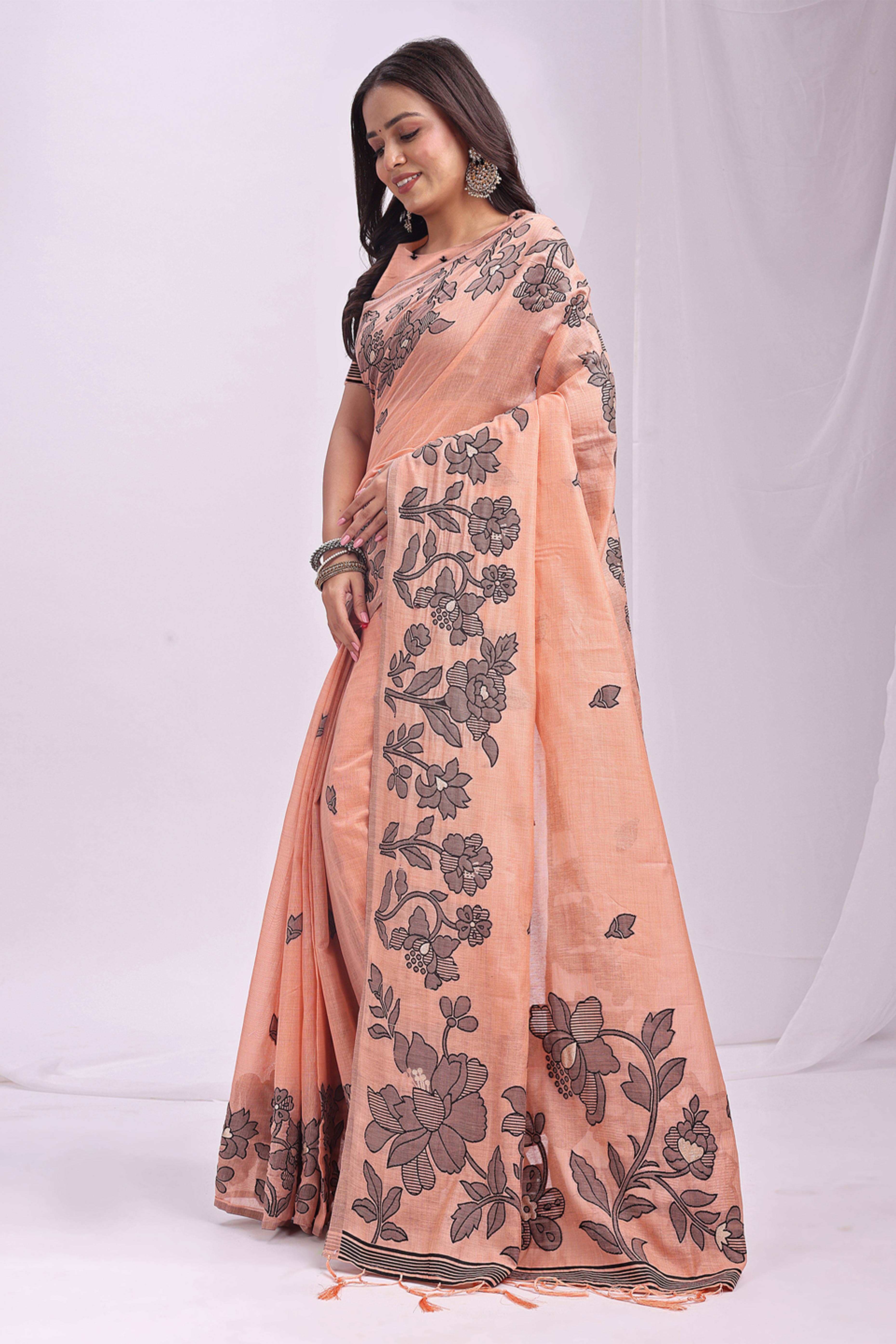 Orange Ethnic Saree in a Linen Cotton Blend Adorned with Floral Weave Designs