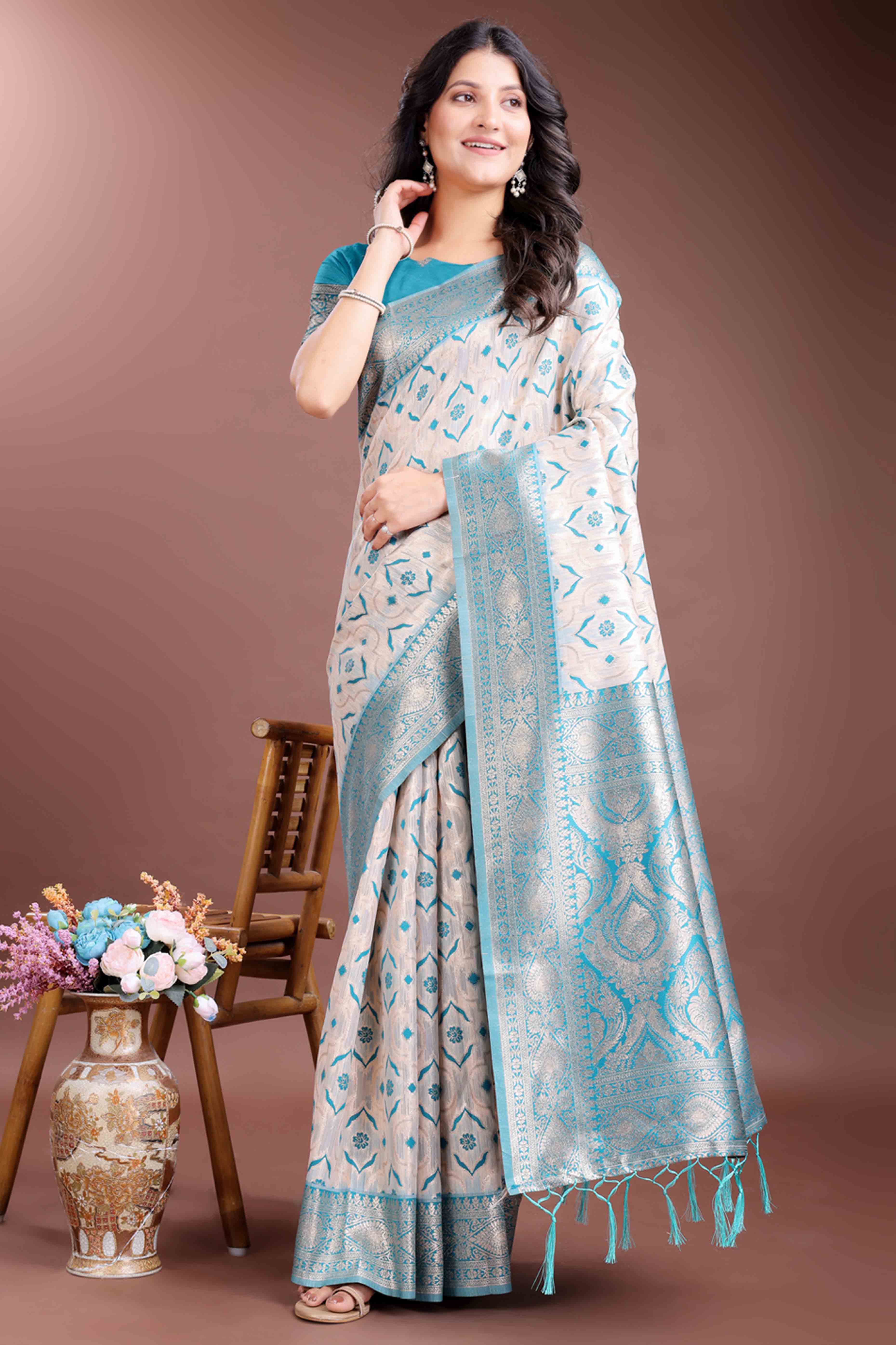 Brilliant Turquoise Traditional Ikkat Style Zari Weaving Cotton Blend Saree with Stunning Tassel Accents