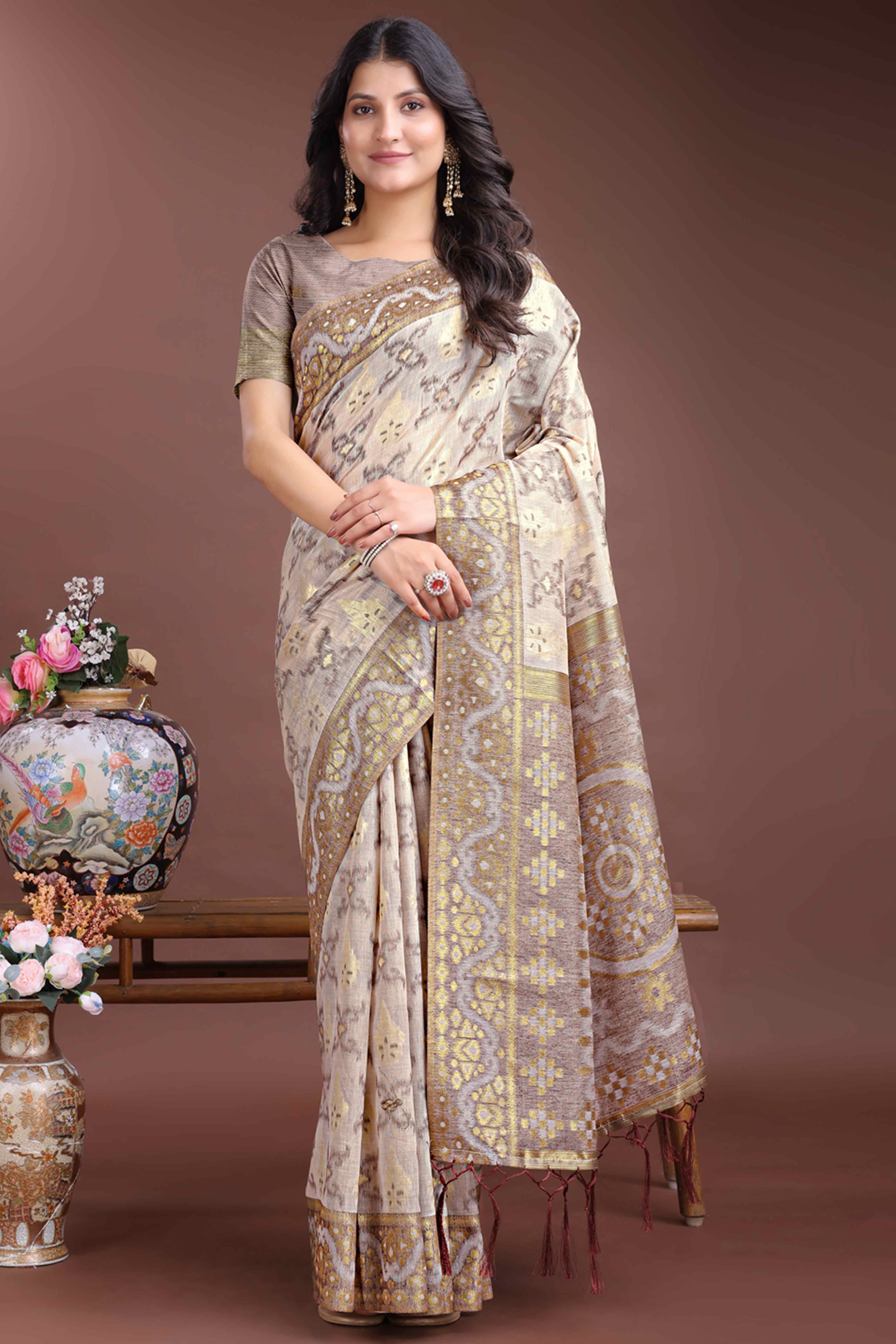 Sophisticated Brown Traditional Ikkat Style Zari Weaving Cotton Blend Saree Adorned with Elegant Tassels