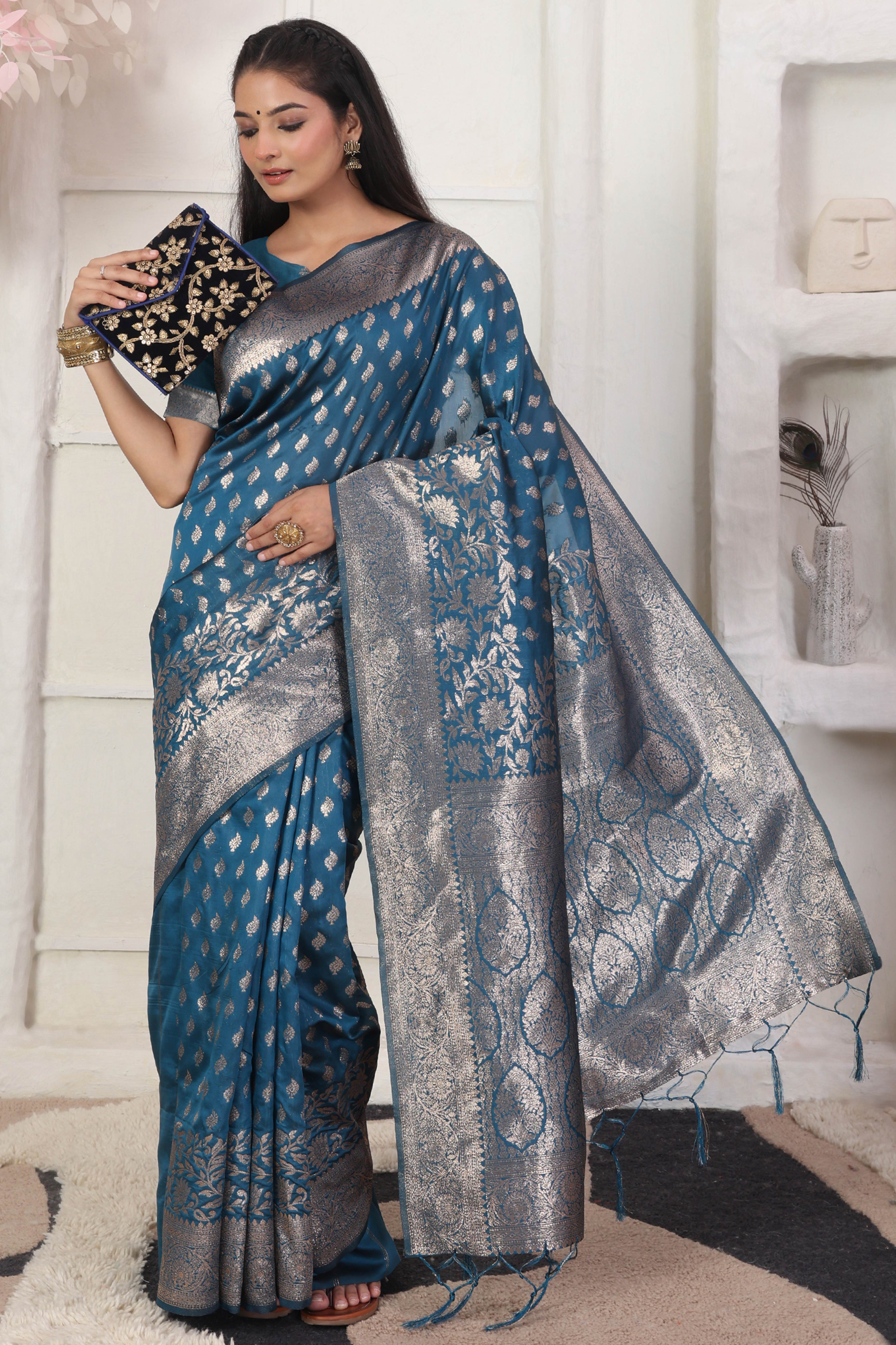 Blue Traditional Lichi Silk Blend Saree Enhanced With Floral Zari Weaving & Tassel Pallu