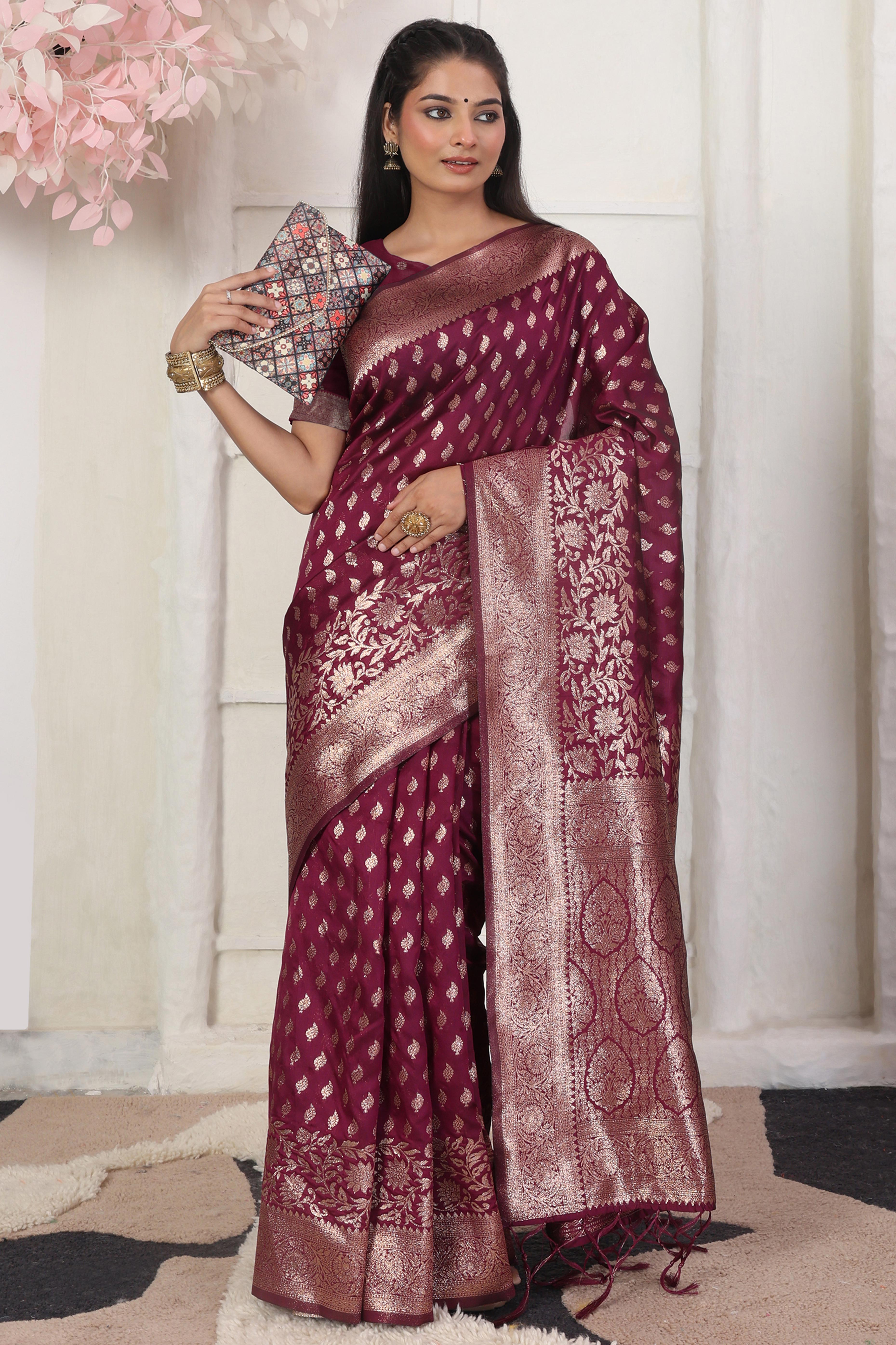 Wine Traditional Lichi Silk Blend Saree Enhanced With Floral Zari Weaving & Tassel Pallu
