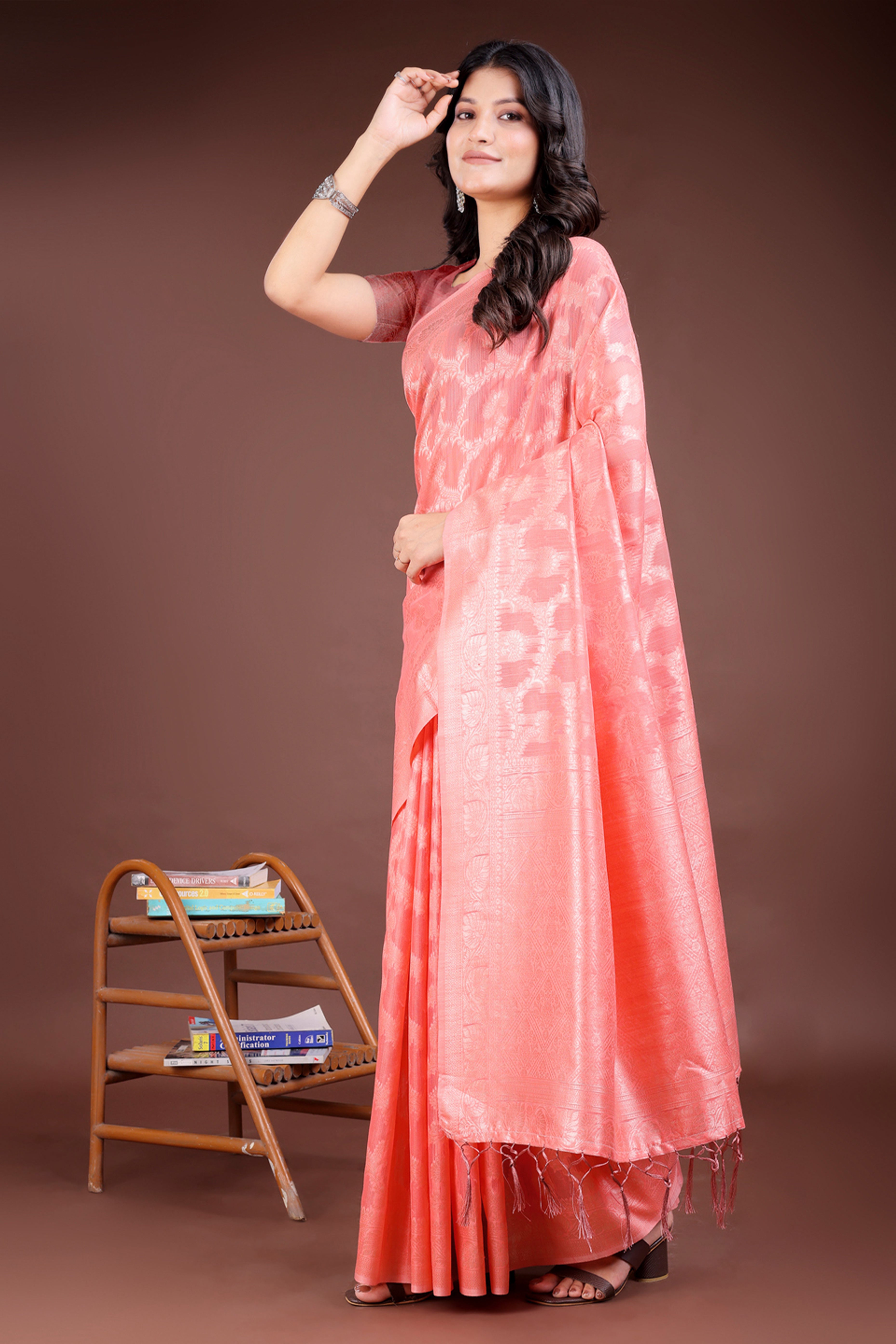 Peach Linen Cotton Saree with Lustrous Zari Borders and Elegant Tassel Accents