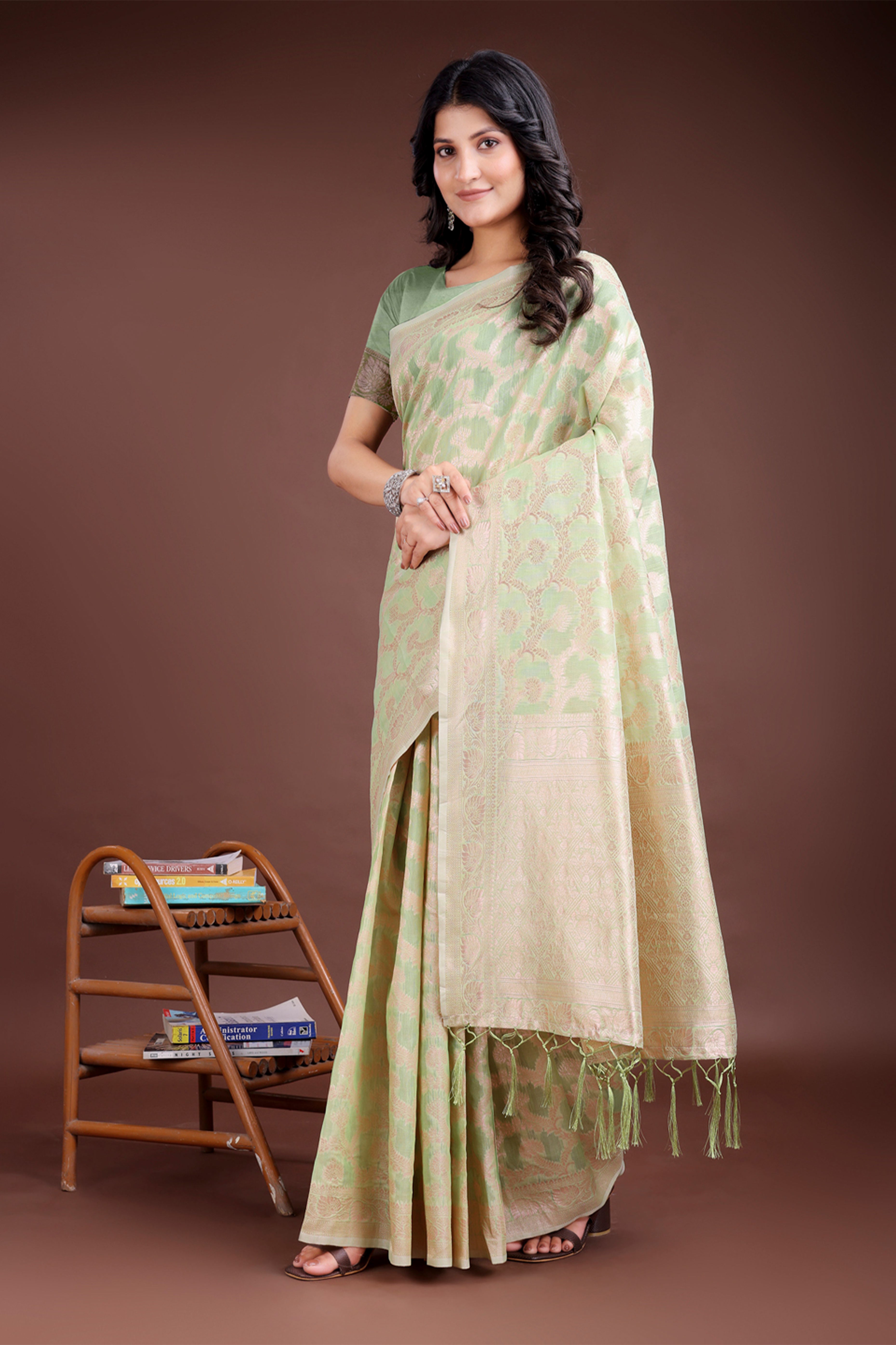 Light Green Linen Cotton Saree with Lustrous Zari Borders and Elegant Tassel Accents