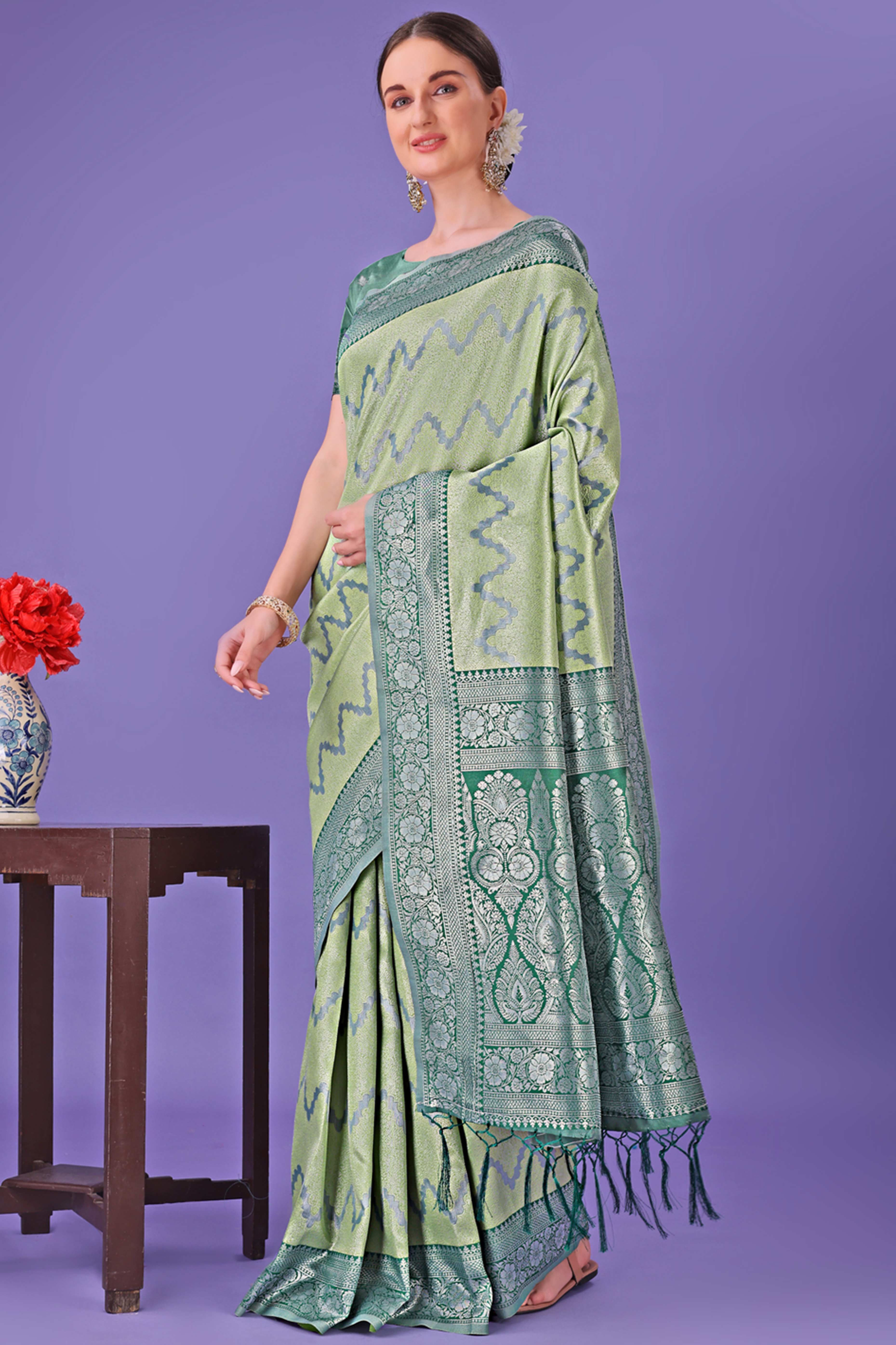 Light Green Lichi Cotton Silk Saree Adorned With Floral Zari Weave & Tassels