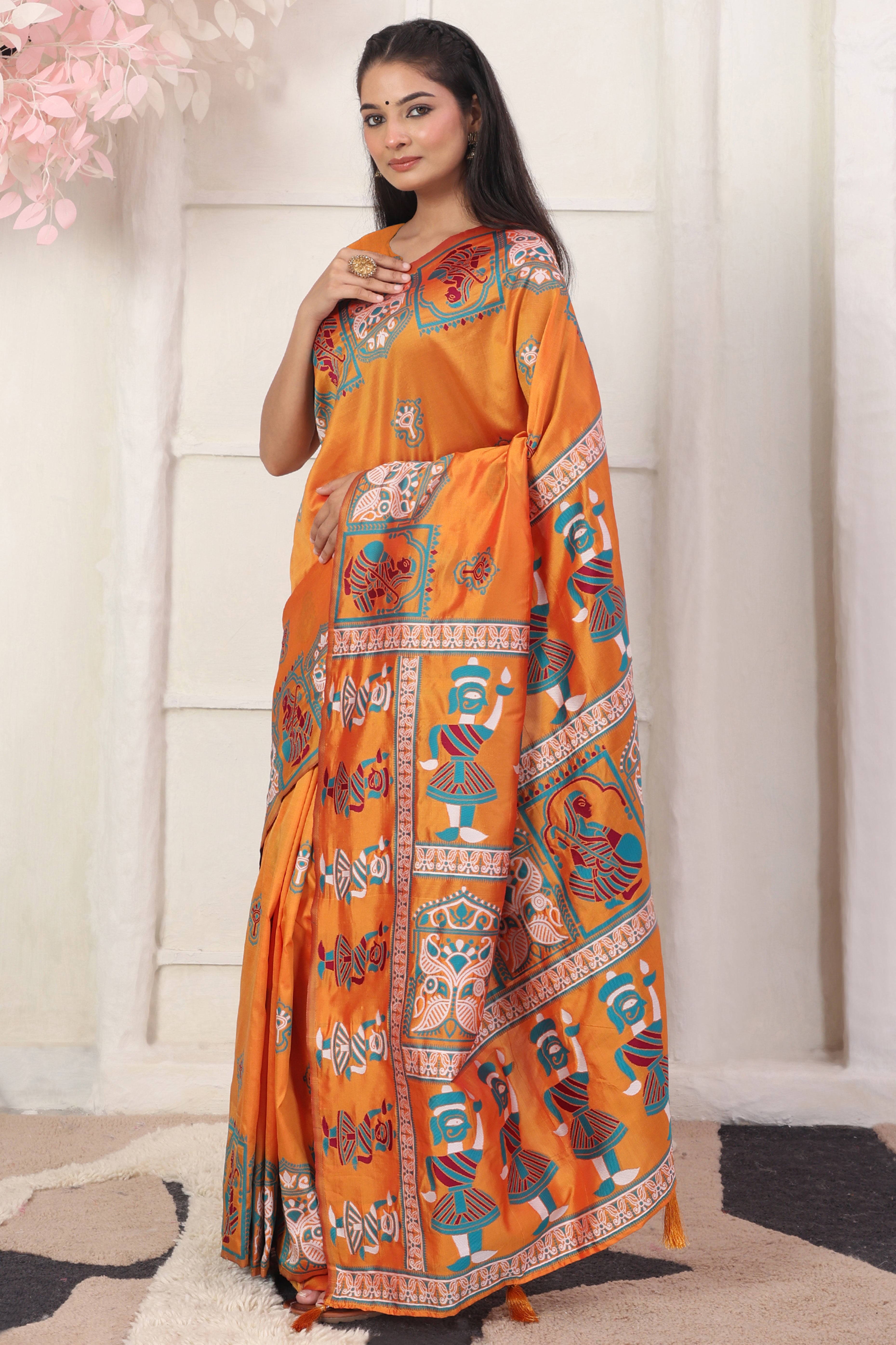 Orange Ethnic Madhubani Print Silk Blend Saree Enhanced With Tassel Pallu Accents