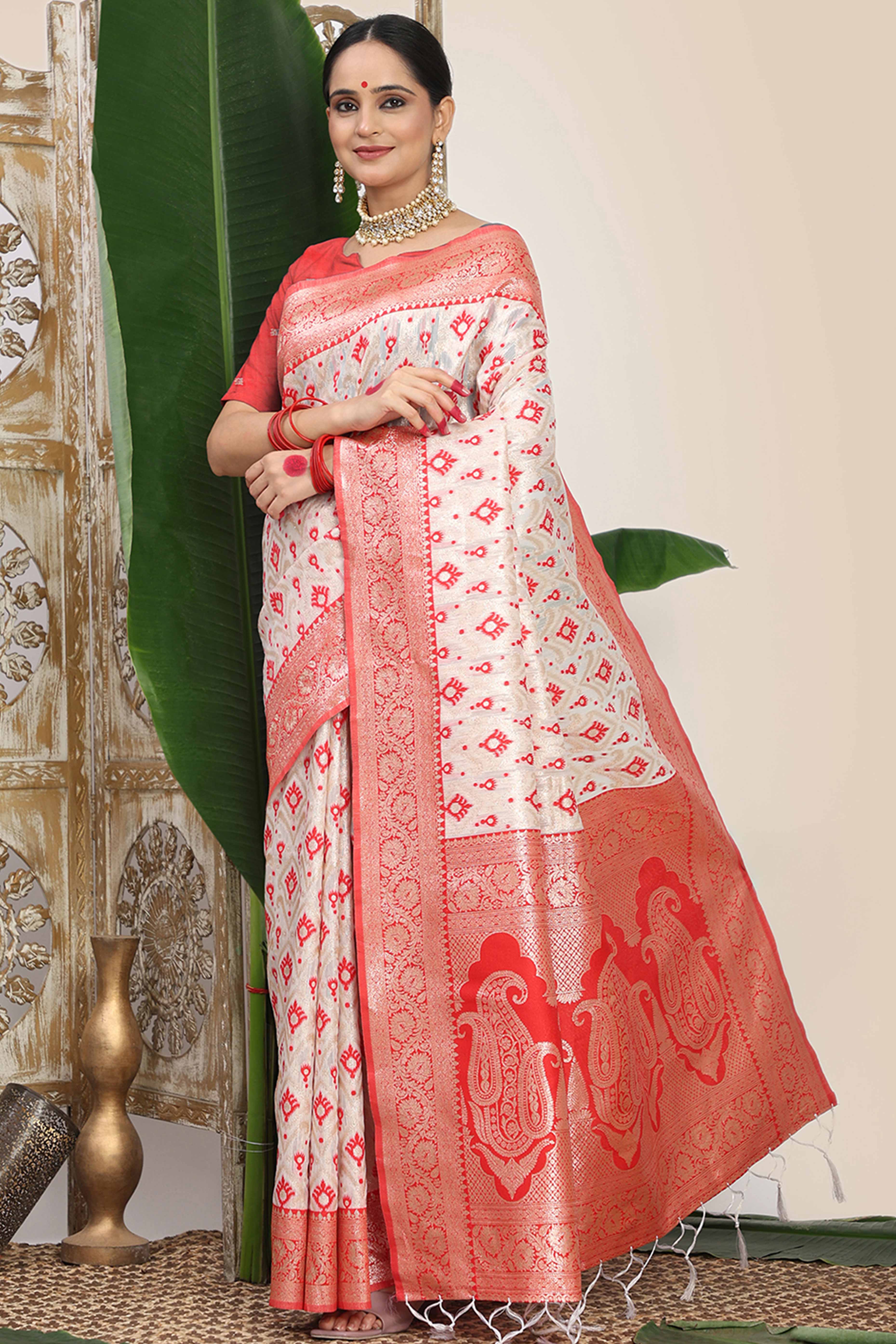 White & Red Linen Cotton Saree Accented With Rich Zari Weaving And A Decorative Tassel Pallu