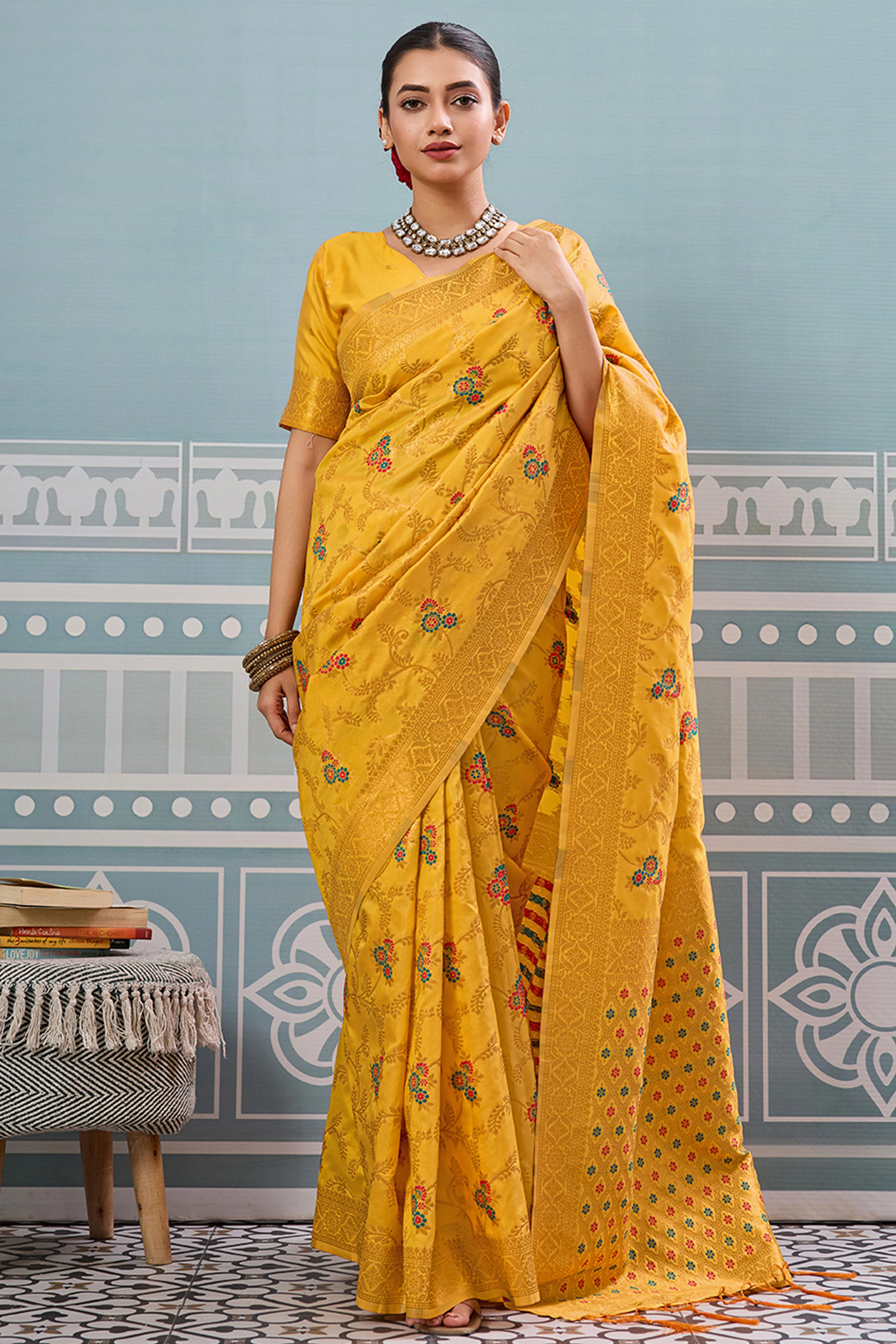 Majestic Bloom Yellow Floral Zari Weaving Silk Blend Saree With Elegant Tassel Pallu