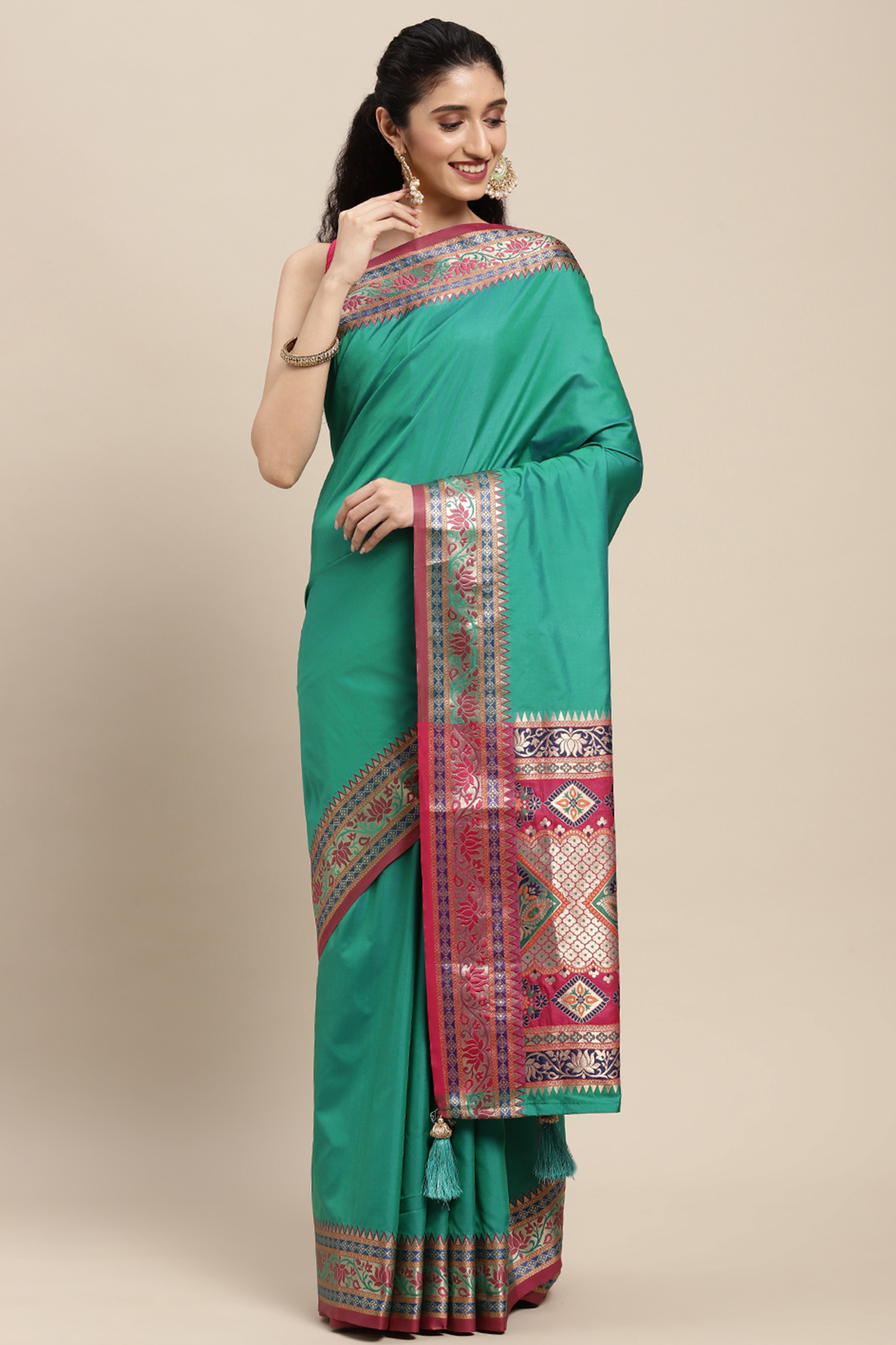 Graceful Rama Green Solid Saree Highlighted With Floral Zari Weaving On Silk Blend & Tassel Pallu
