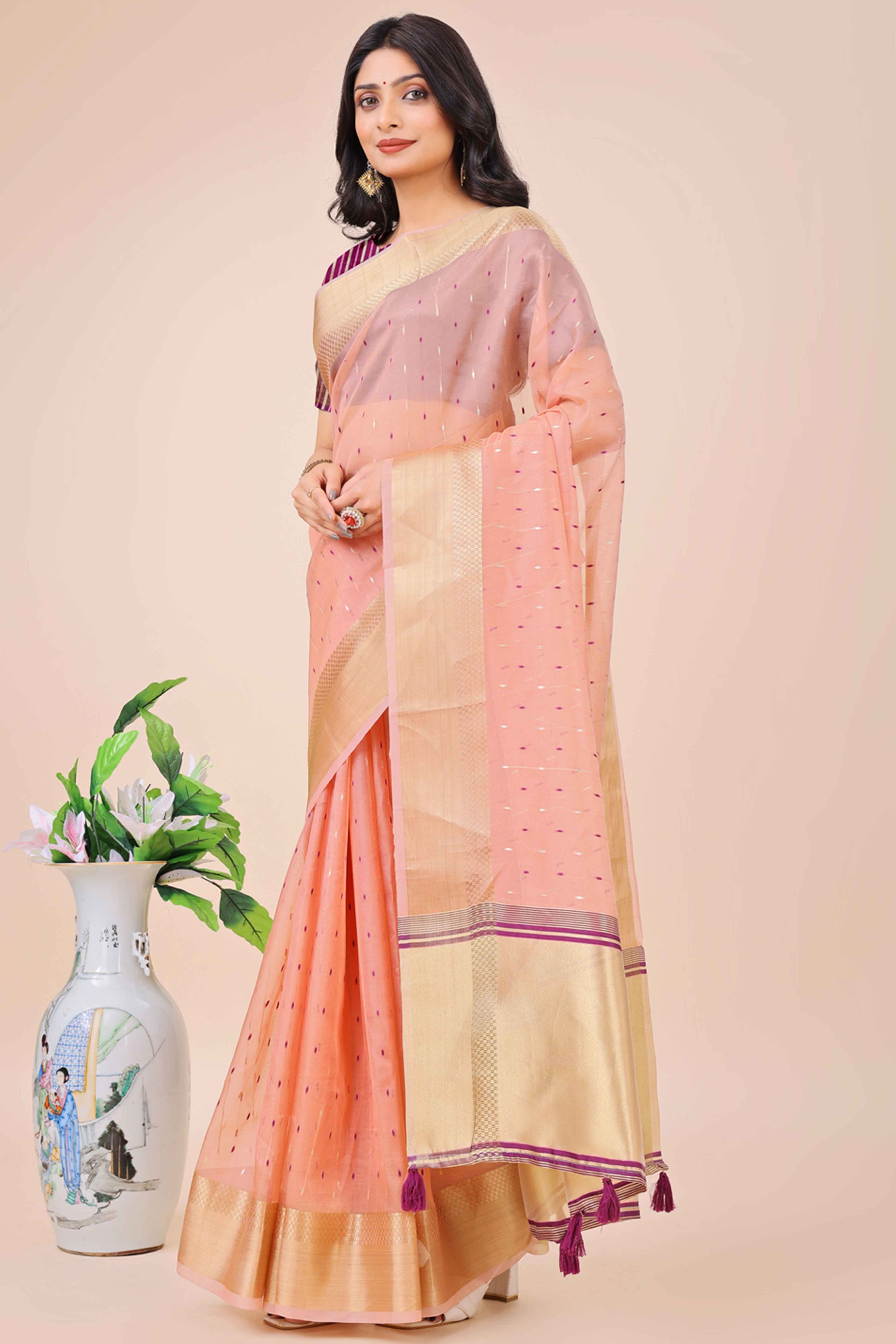 Light Pink Organza Saree Adorned With Fine Zari Weaving & Stylish Tassel Edging