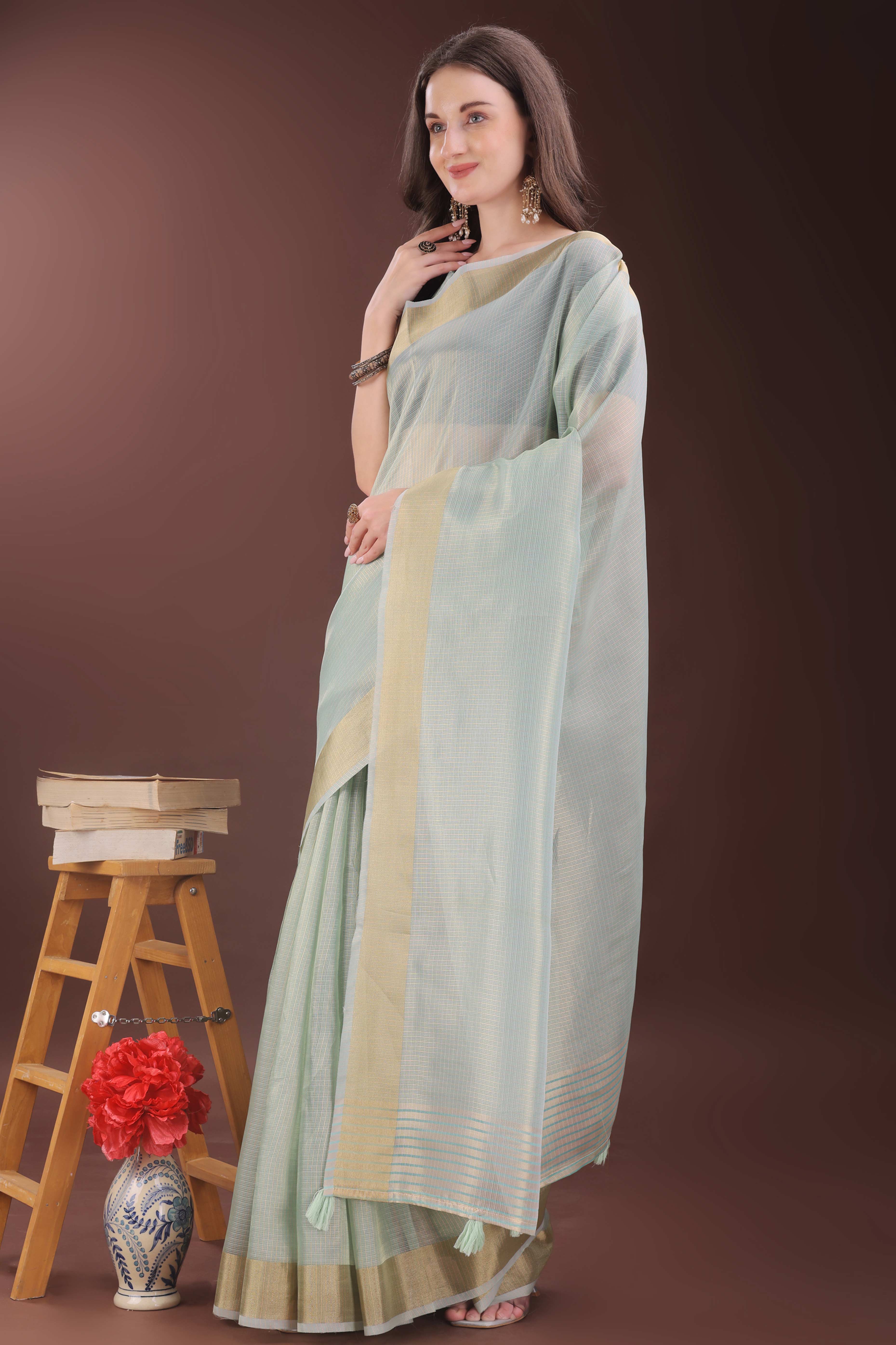 Sea Green Zari Woven Organza Saree With Graceful Tassel Border