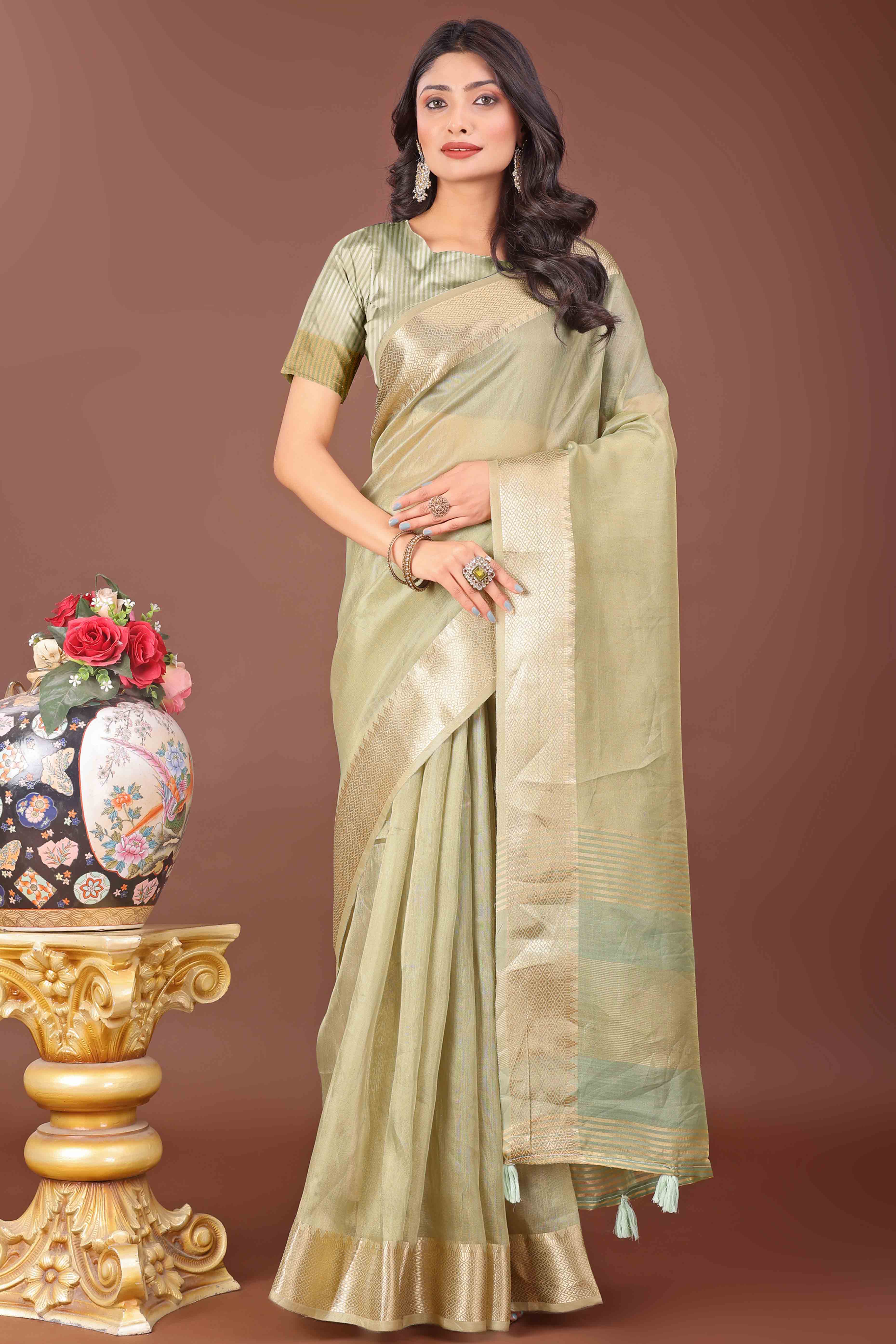Light Green Solid With Zari Woven Organza Saree With Tassel Border