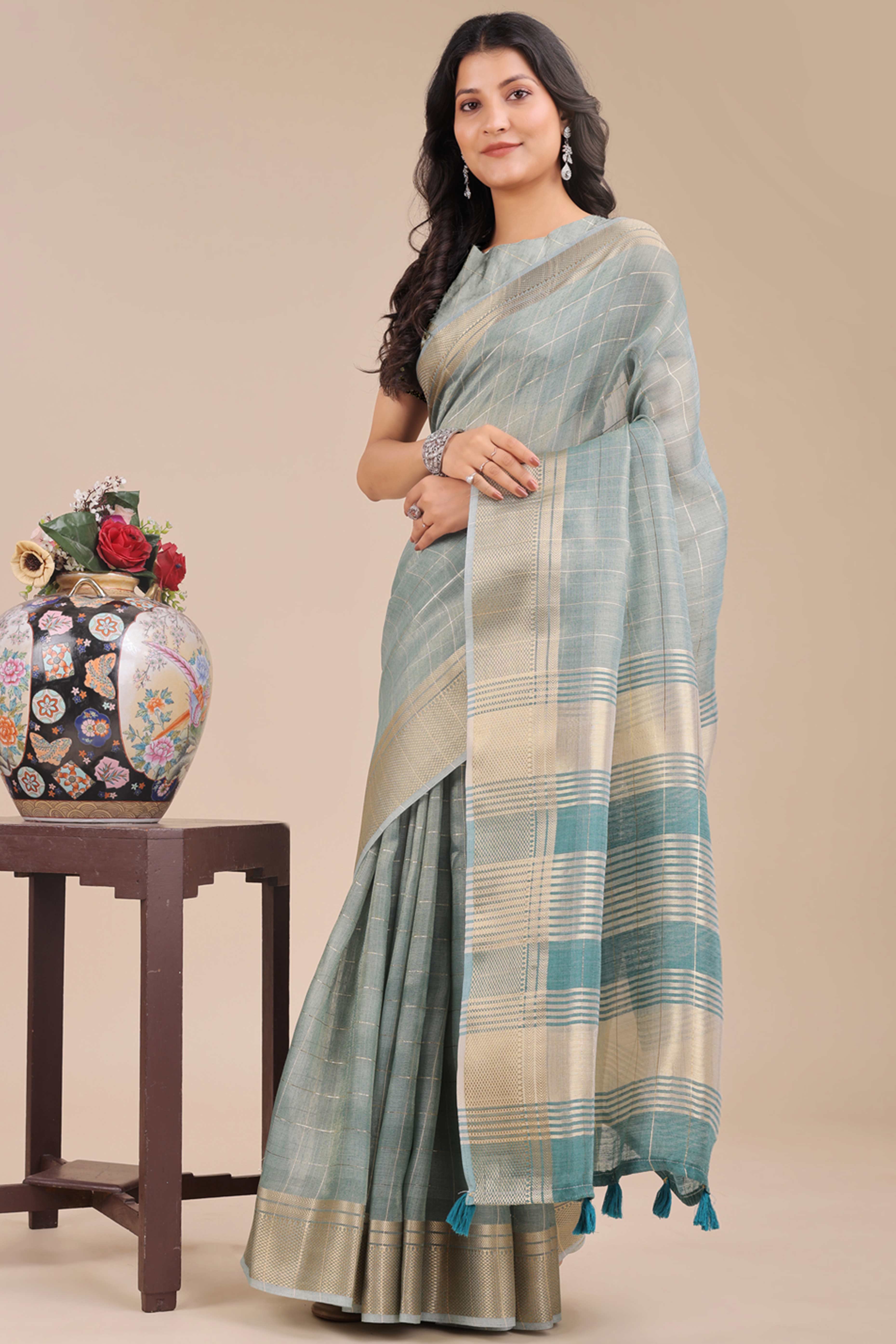 Sea Green Organza Saree with Checkered Zari Weaving Pattern and Tassels