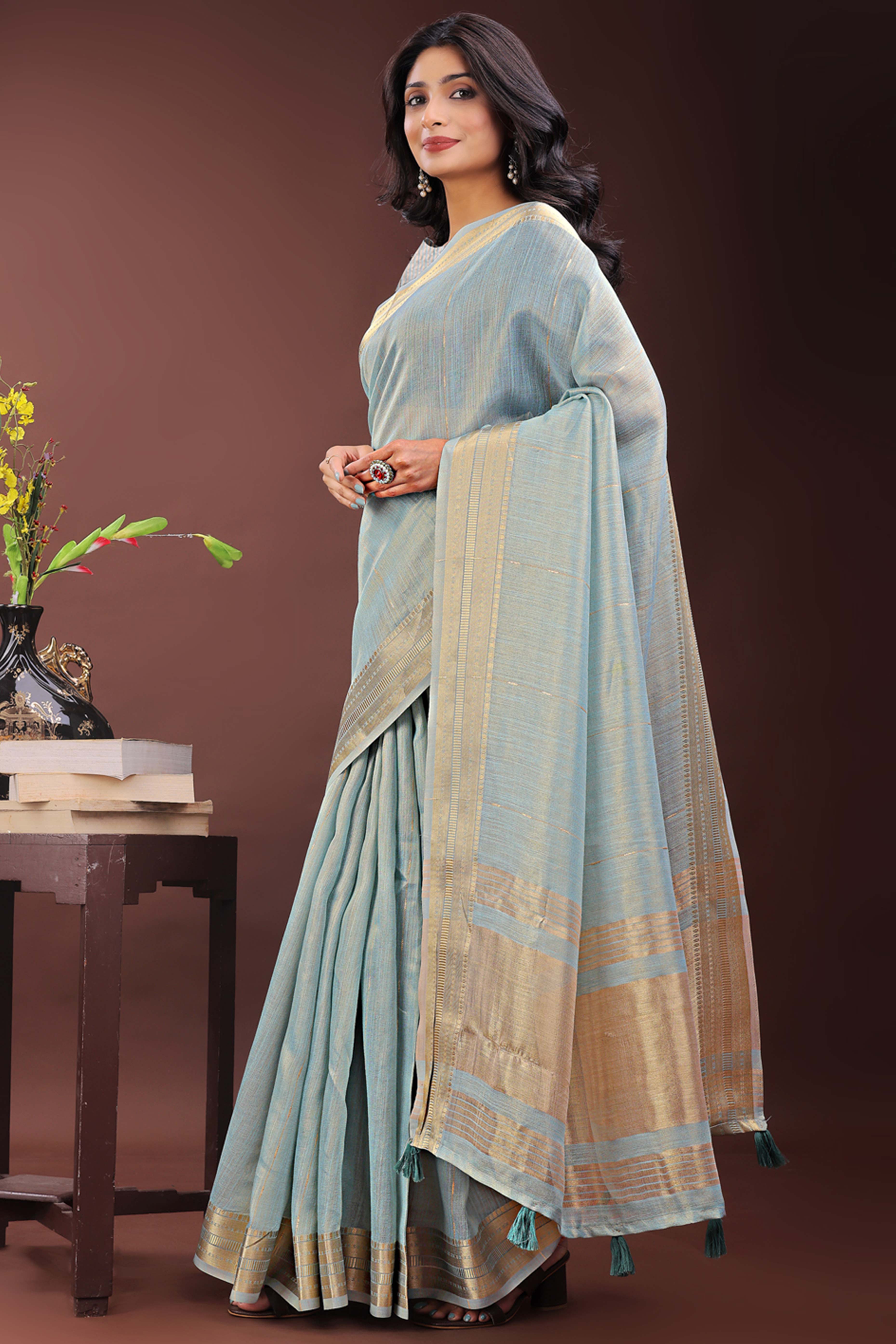 Greyish Blue Organza Saree Adorned With Zari Weave & Tassel Edges