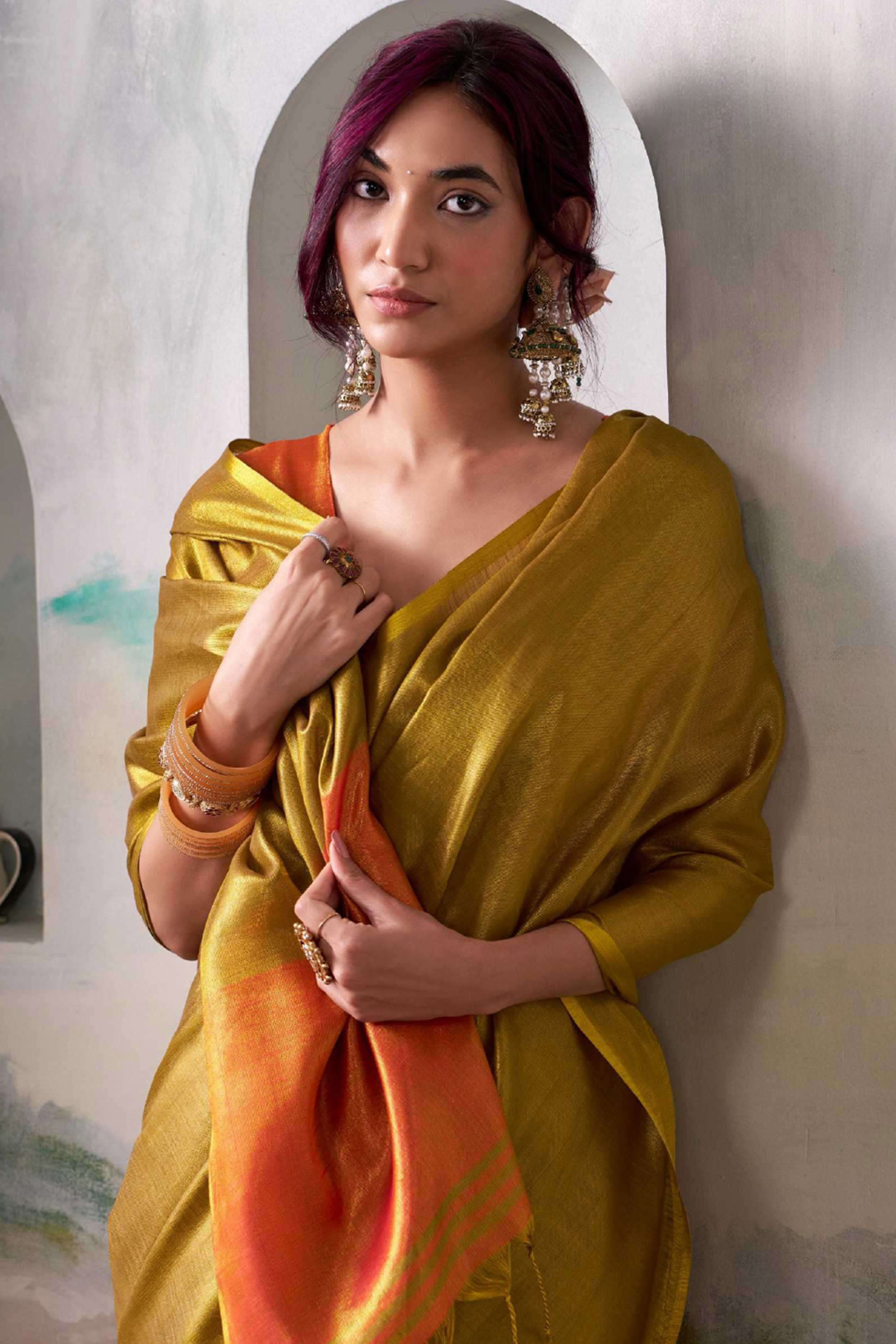 Graceful Dark Mustard Tissue Silk Blend Saree Adorned with Intricate Zari Weaving & Tassel Pallu