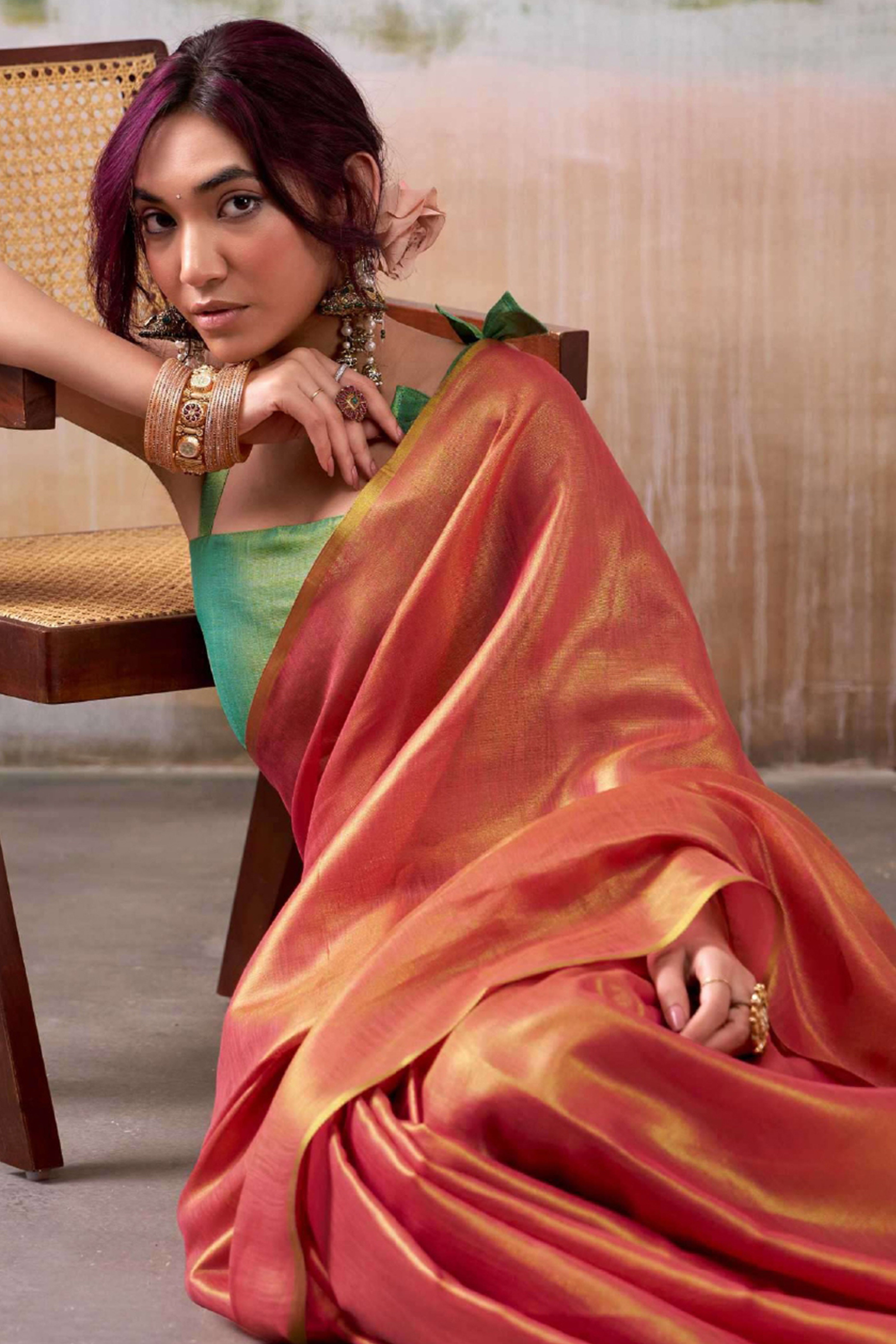 Graceful Pink Tissue Silk Blend Saree Adorned with Intricate Zari Weaving & Tassel Pallu