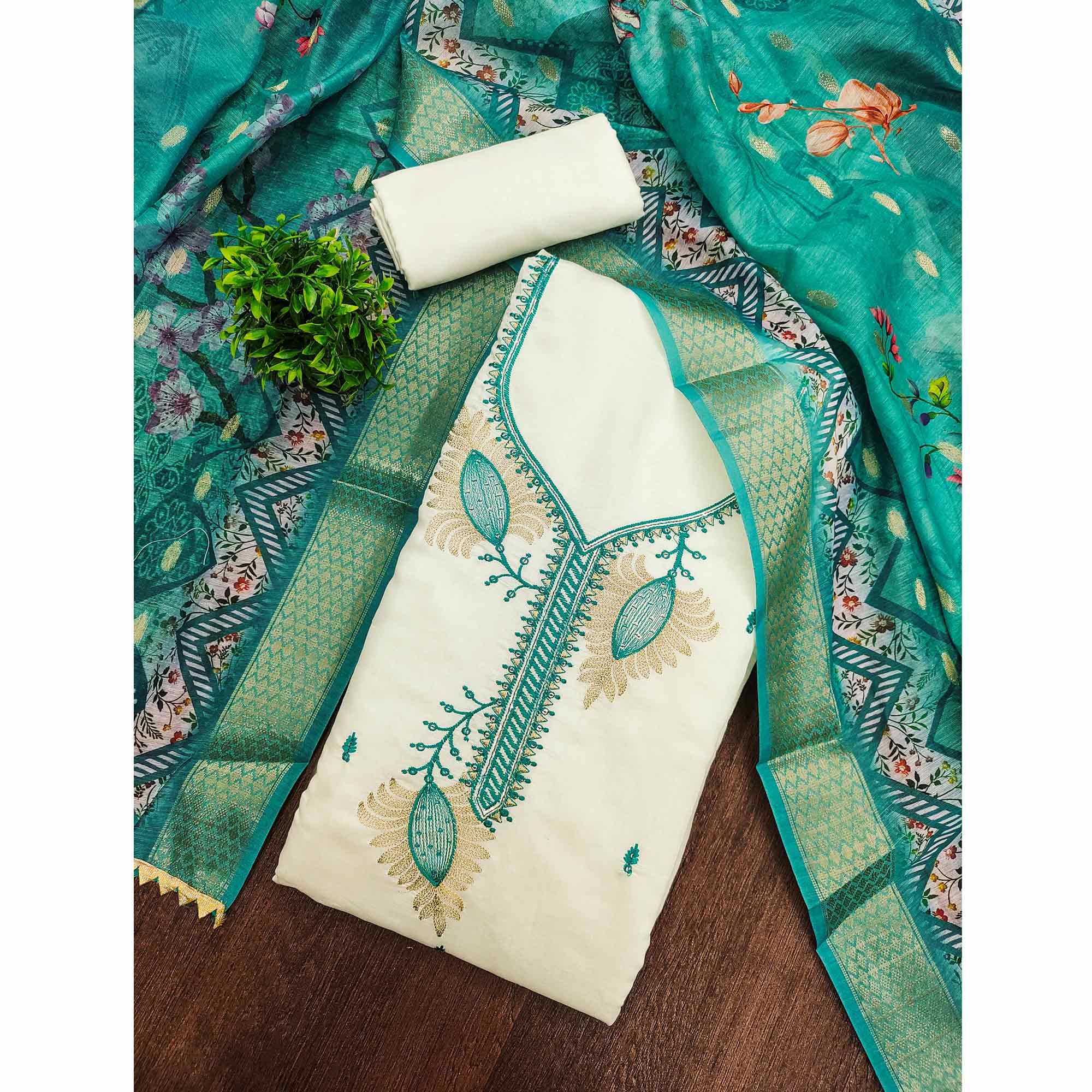 Elegant Cream & Turquoise Floral Embroidered Roman Cotton Silk Dress Material With Sequins Work