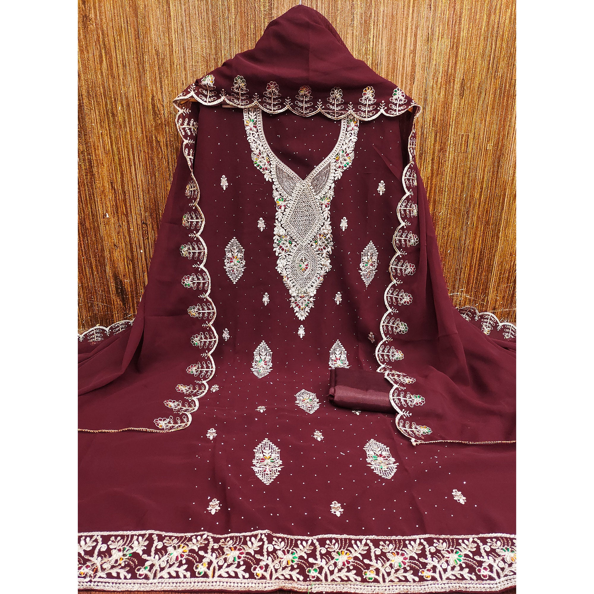 Maroon Georgette Dress Material Adorned With Elegant Floral Embroidery & Shimmering Swarovski Work