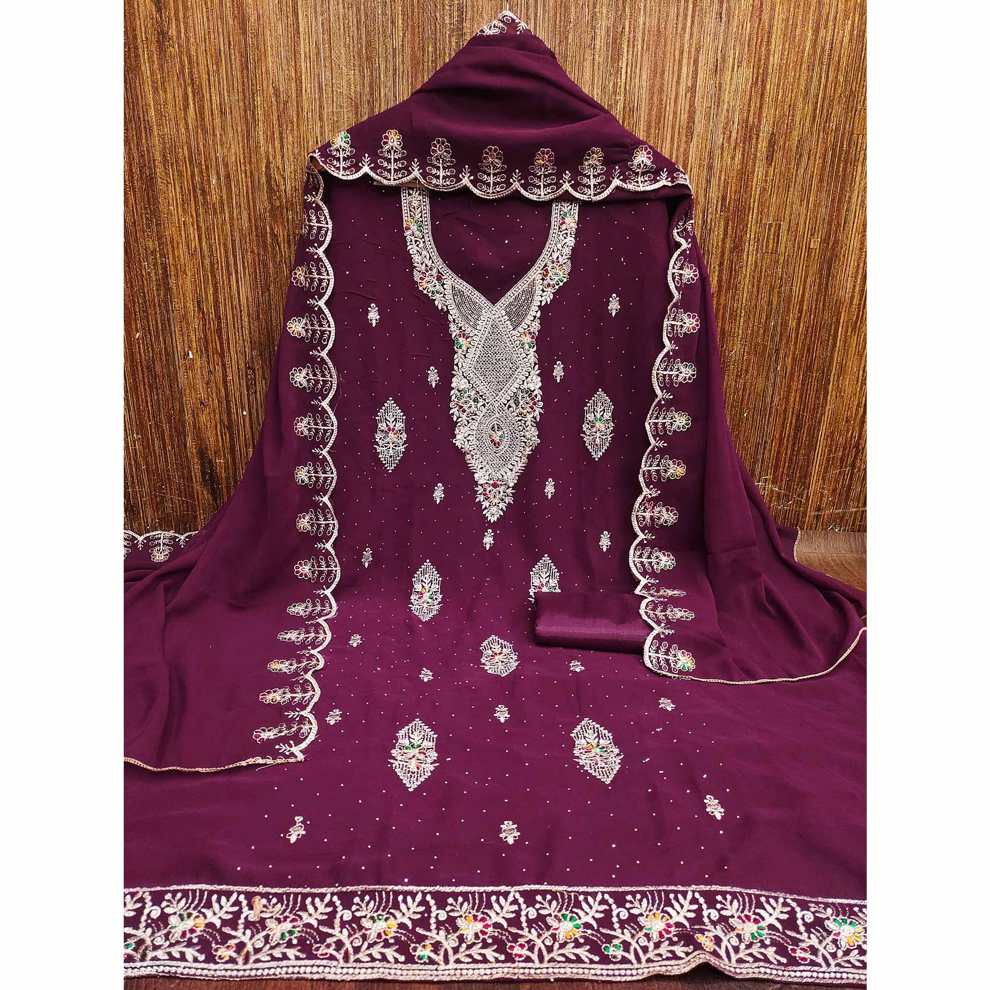 Wine Georgette Dress Material Adorned With Elegant Floral Embroidery & Shimmering Swarovski Work