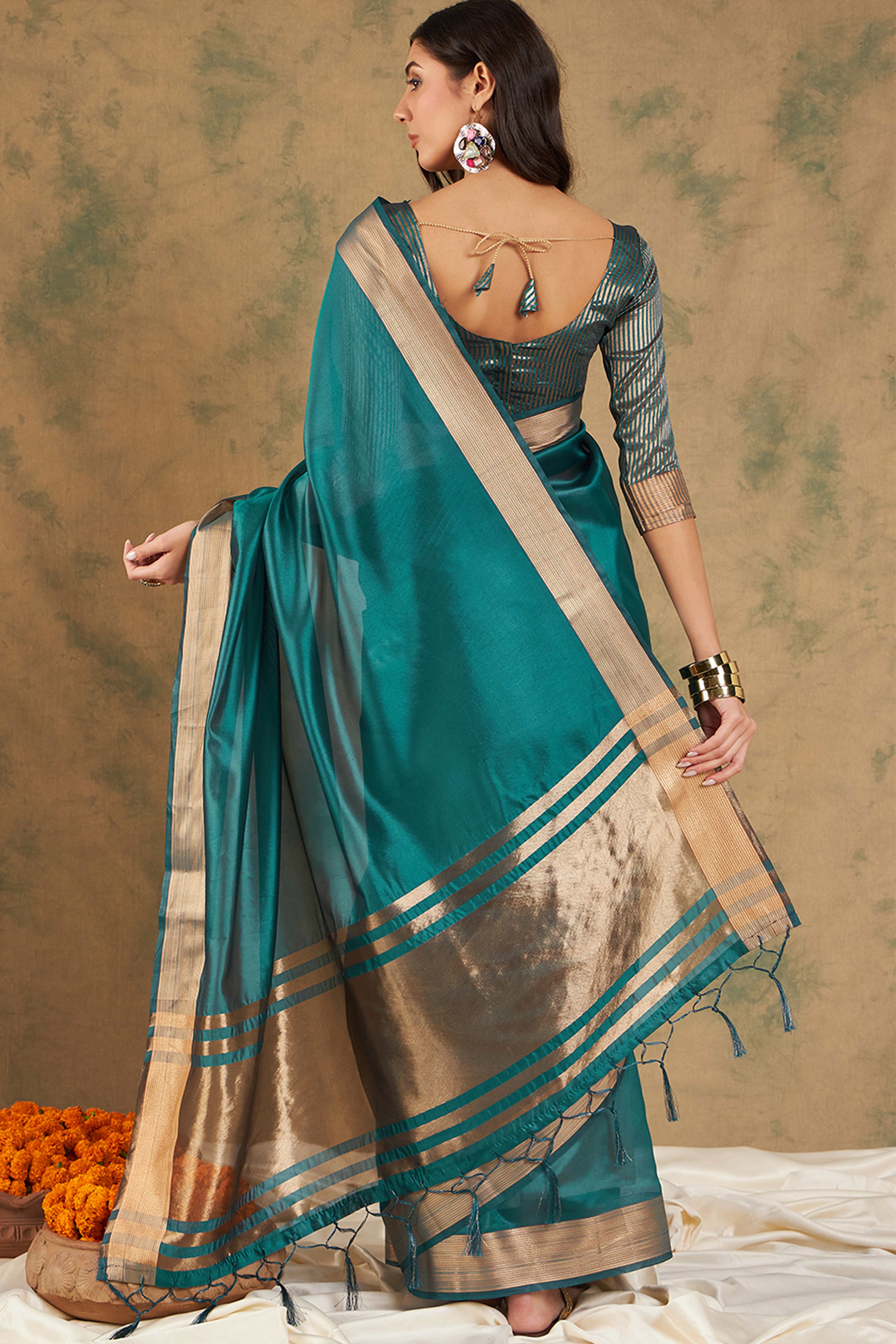 Teal Organza Saree In Organza With Delicate Weaving Border And Tassel Details