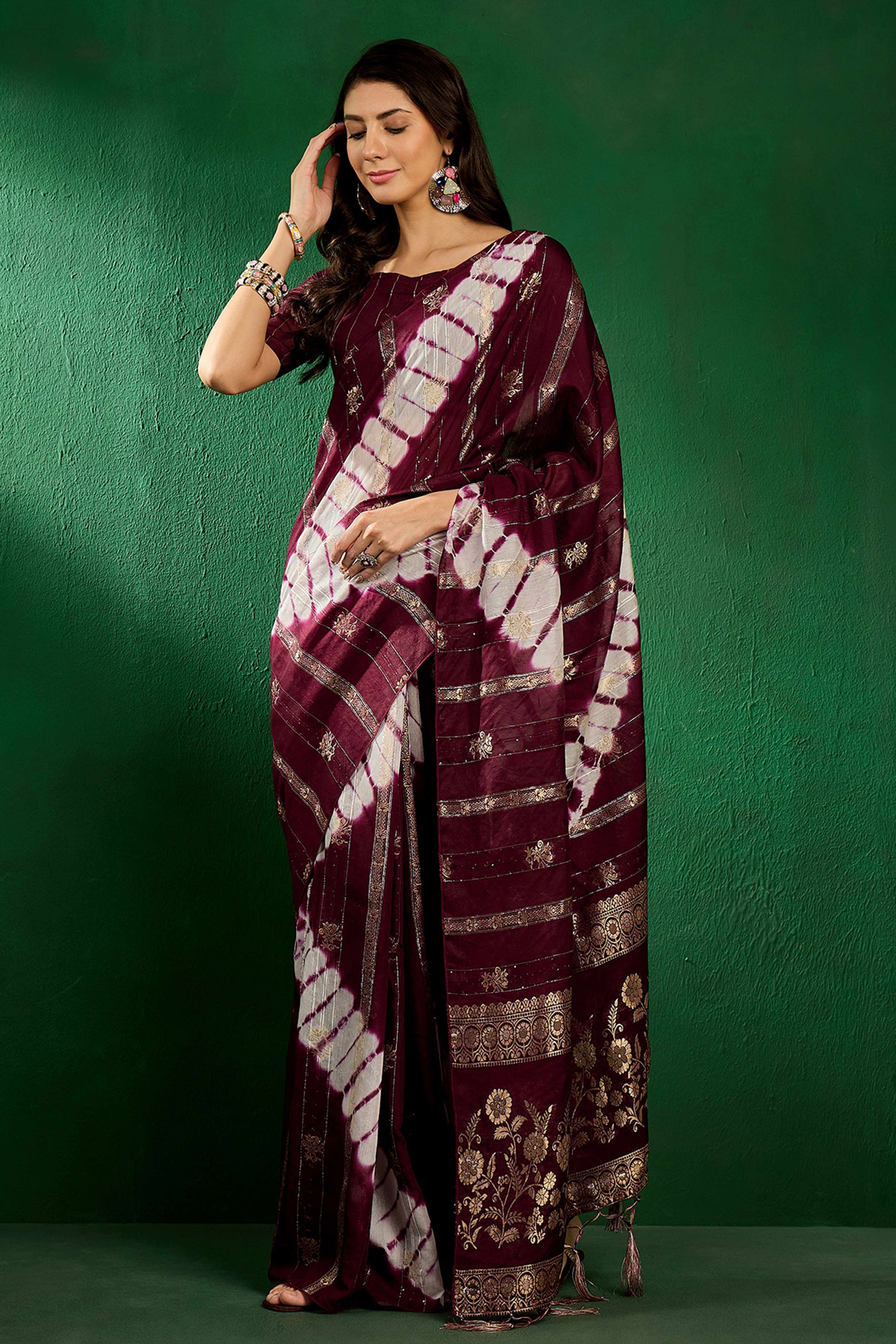 Wine Floral Woven Staple Cotton Blend Saree Highlighted With Sequins Embroidery & Tasselled Pallu