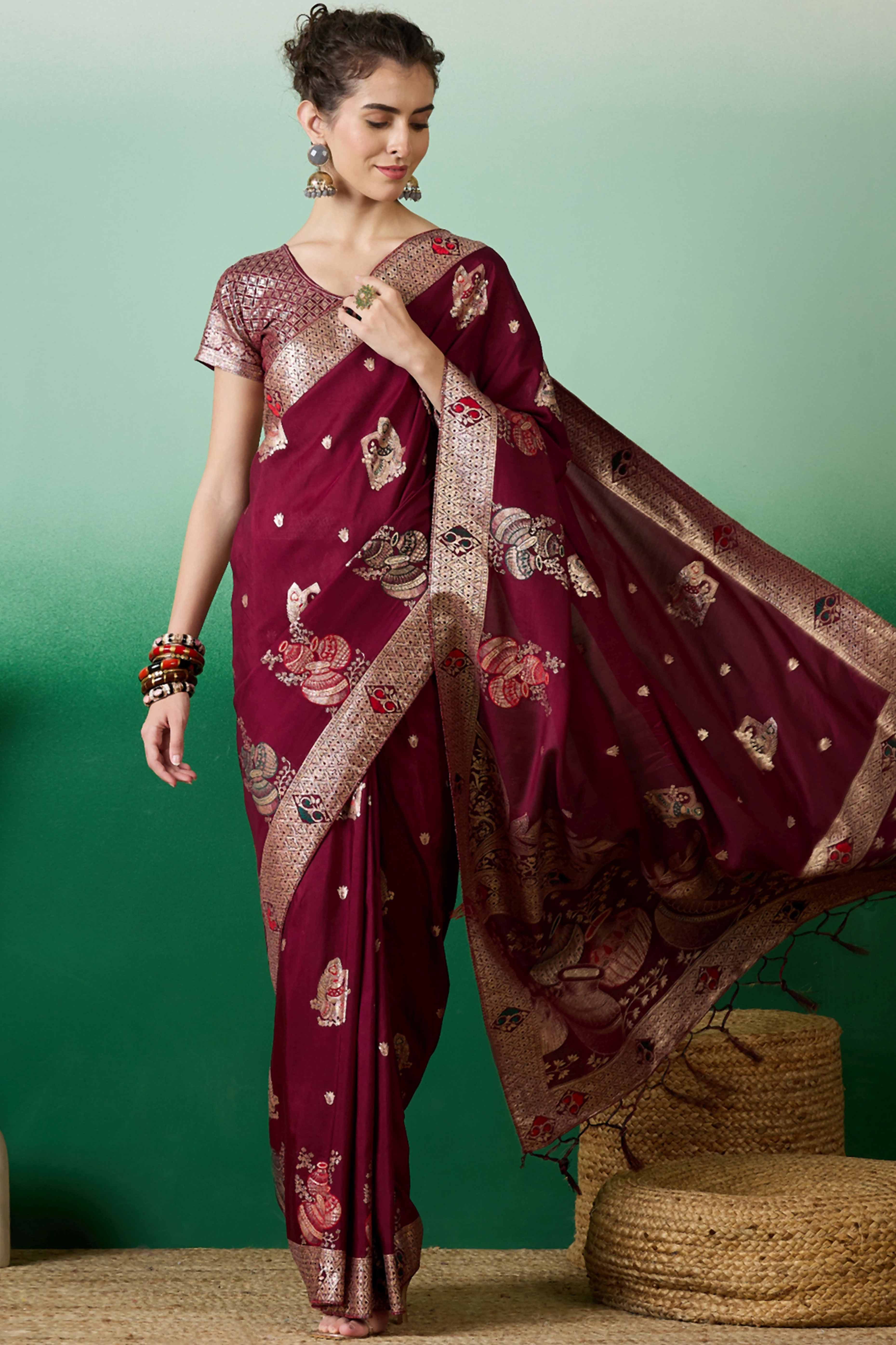 Wine Cotton Blend Saree Adorned With Floral Zari Weaving & Soft Tassel Accents