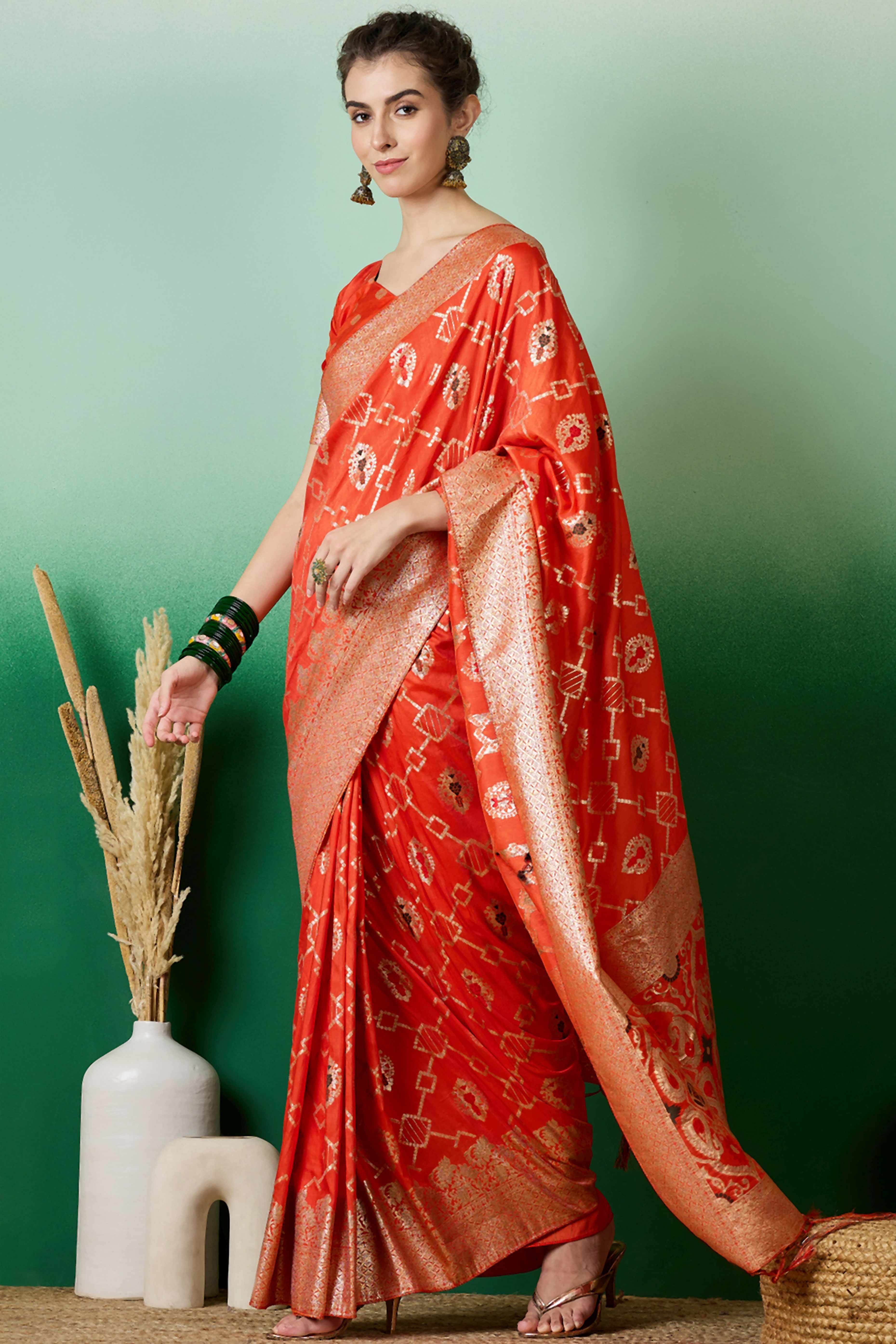 Orange Zari Woven Staple Cotton Blend Saree With Floral Motifs & Tassel Detailed Pallu