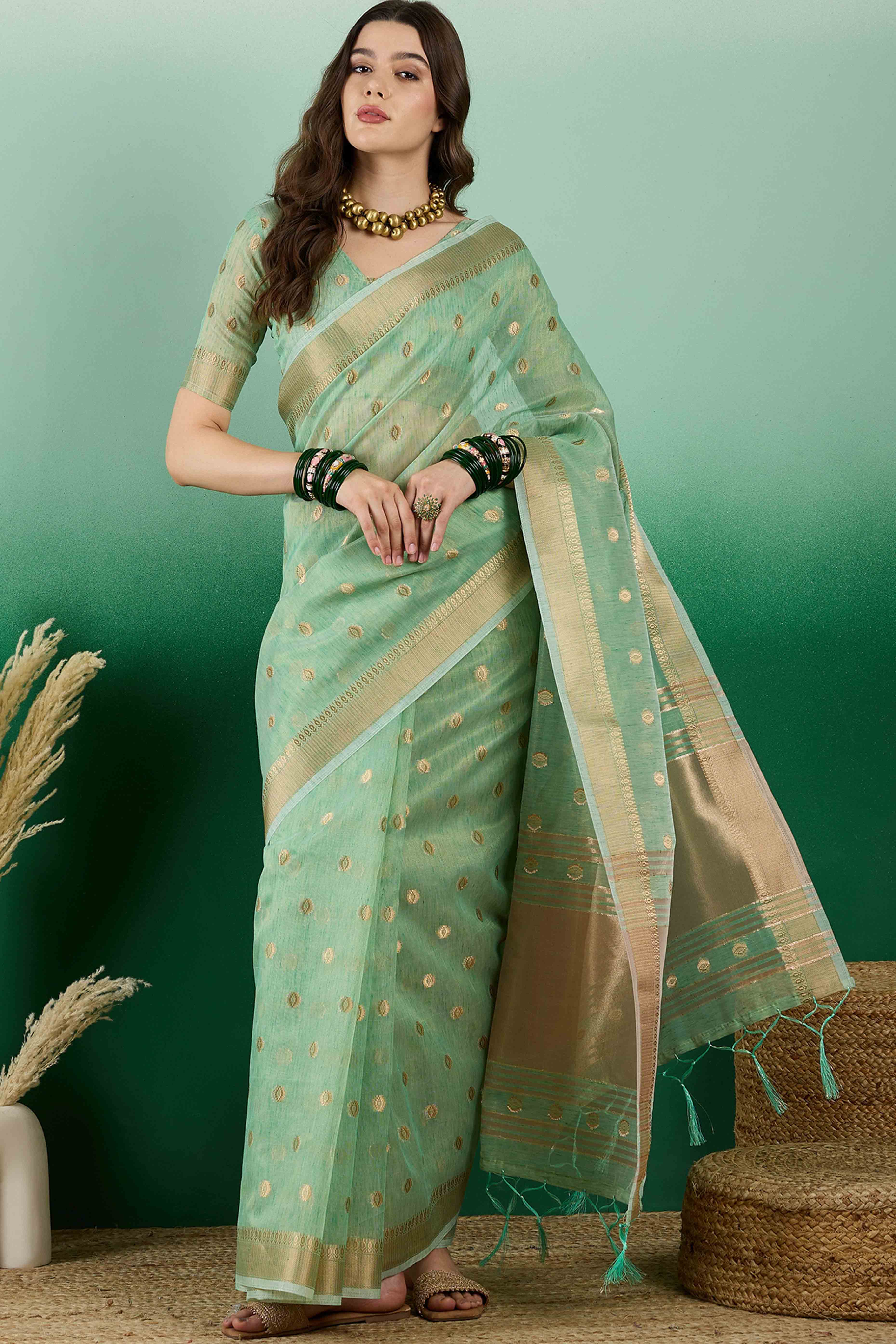 Green Khadi Organza Saree Embellished With Traditional Zari Work & Tassels