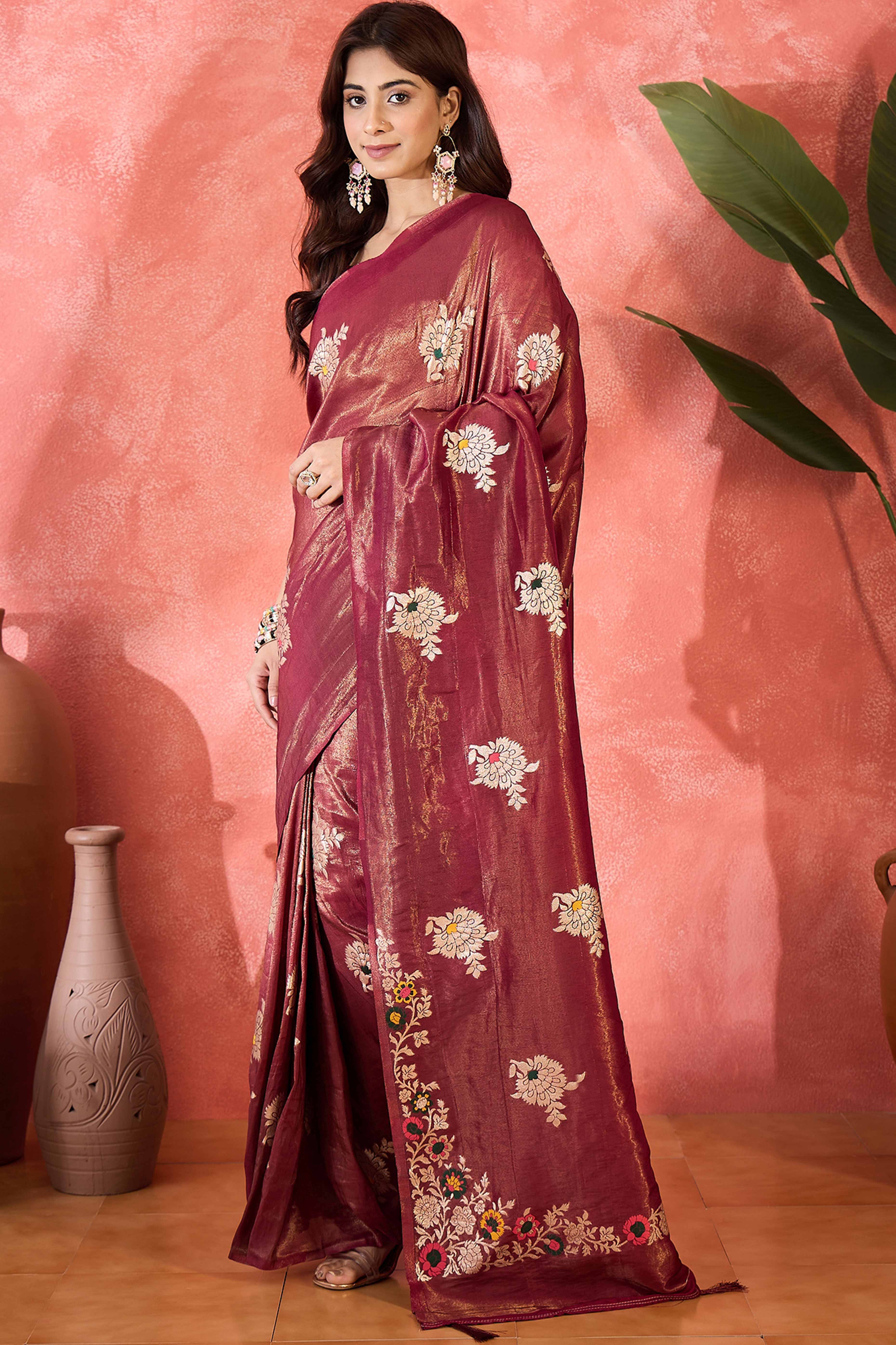 Wine Shimmer Saree Featuring Intricate Floral Zari Weaving & Tassel Finish