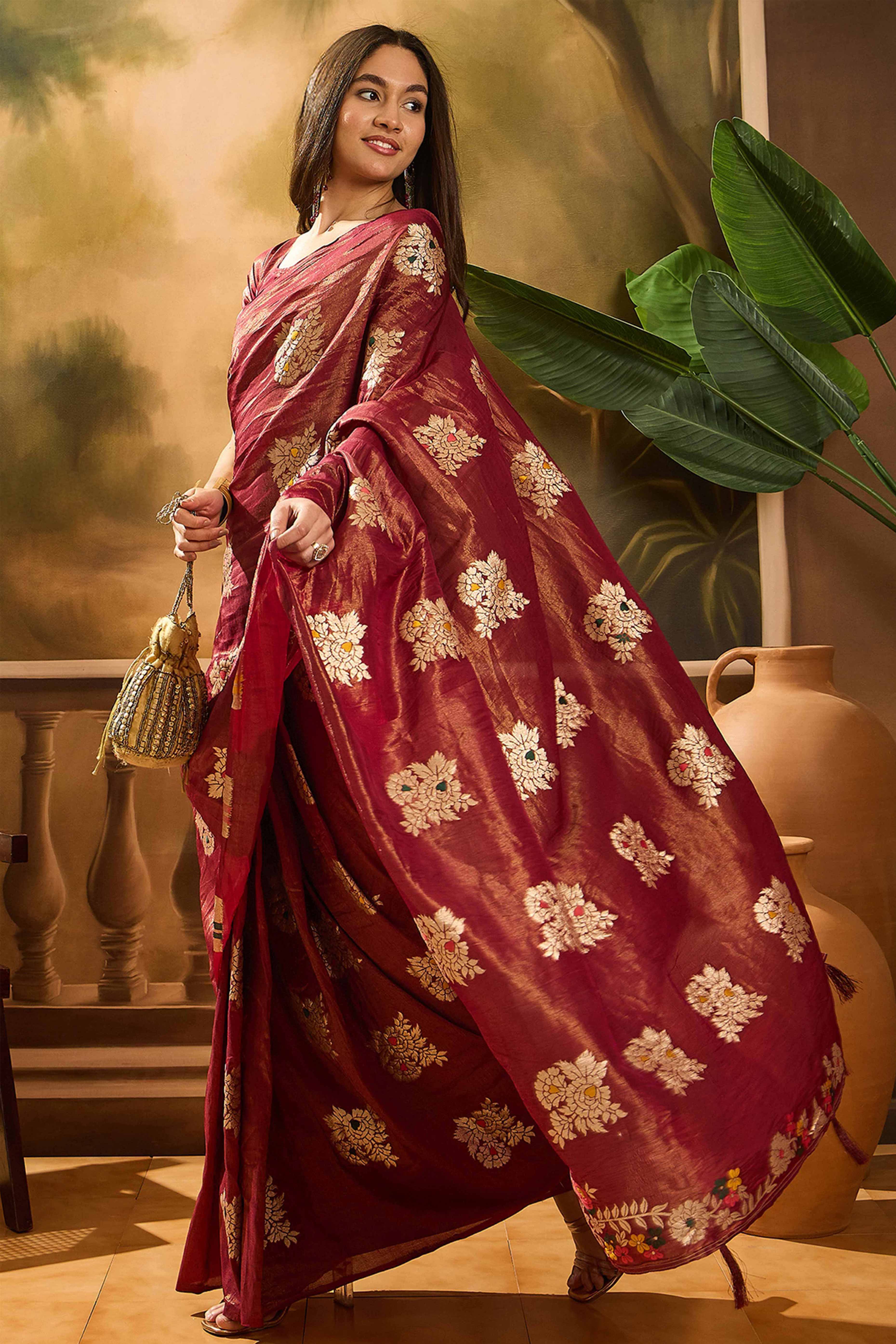 Maroon Saree In Shimmer Fabric With Floral Zari Weaving & Decorative Tassel Pallu
