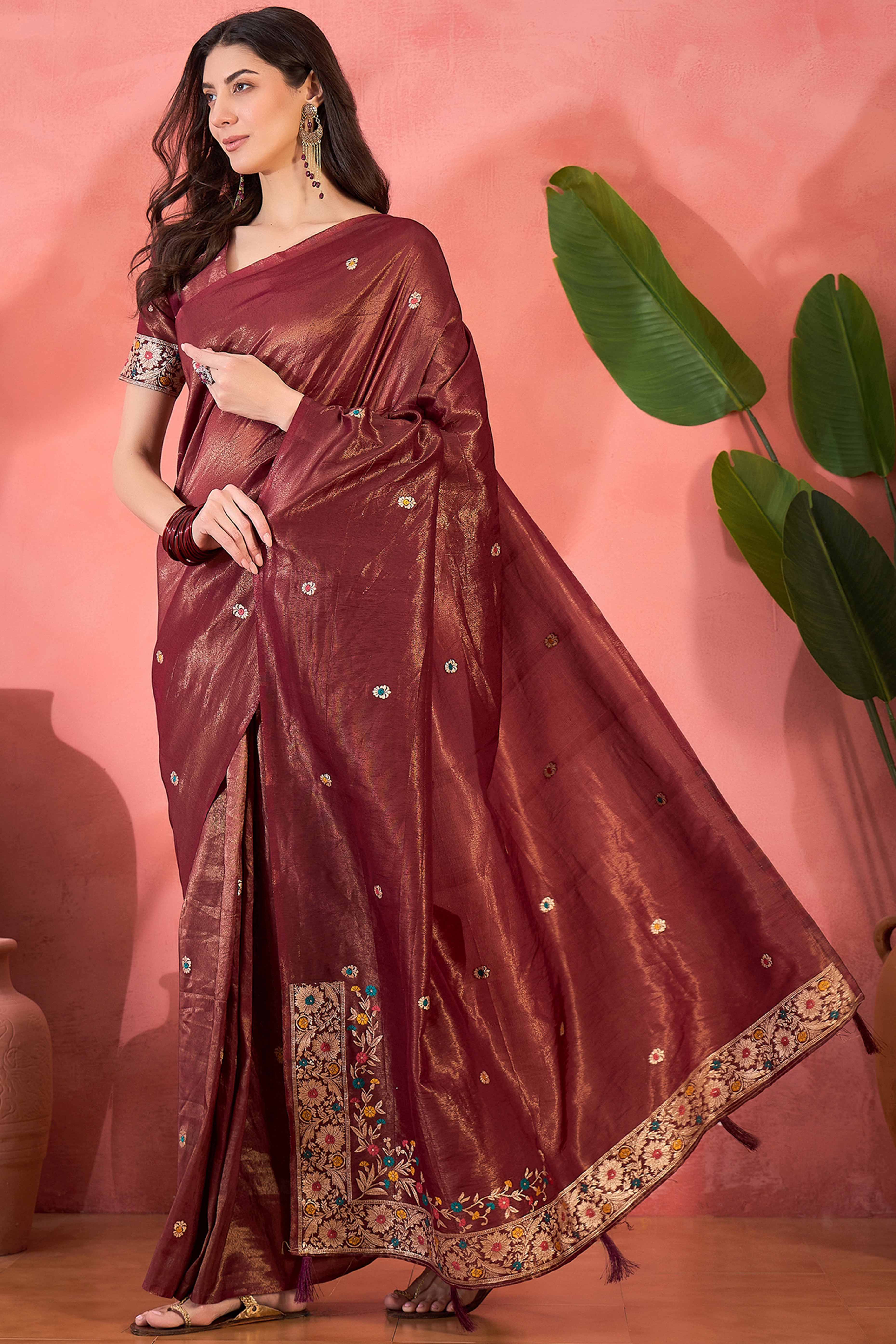 Maroon Zari Woven Shimmer Saree With Floral Motifs & Flowing Tassel Pallu