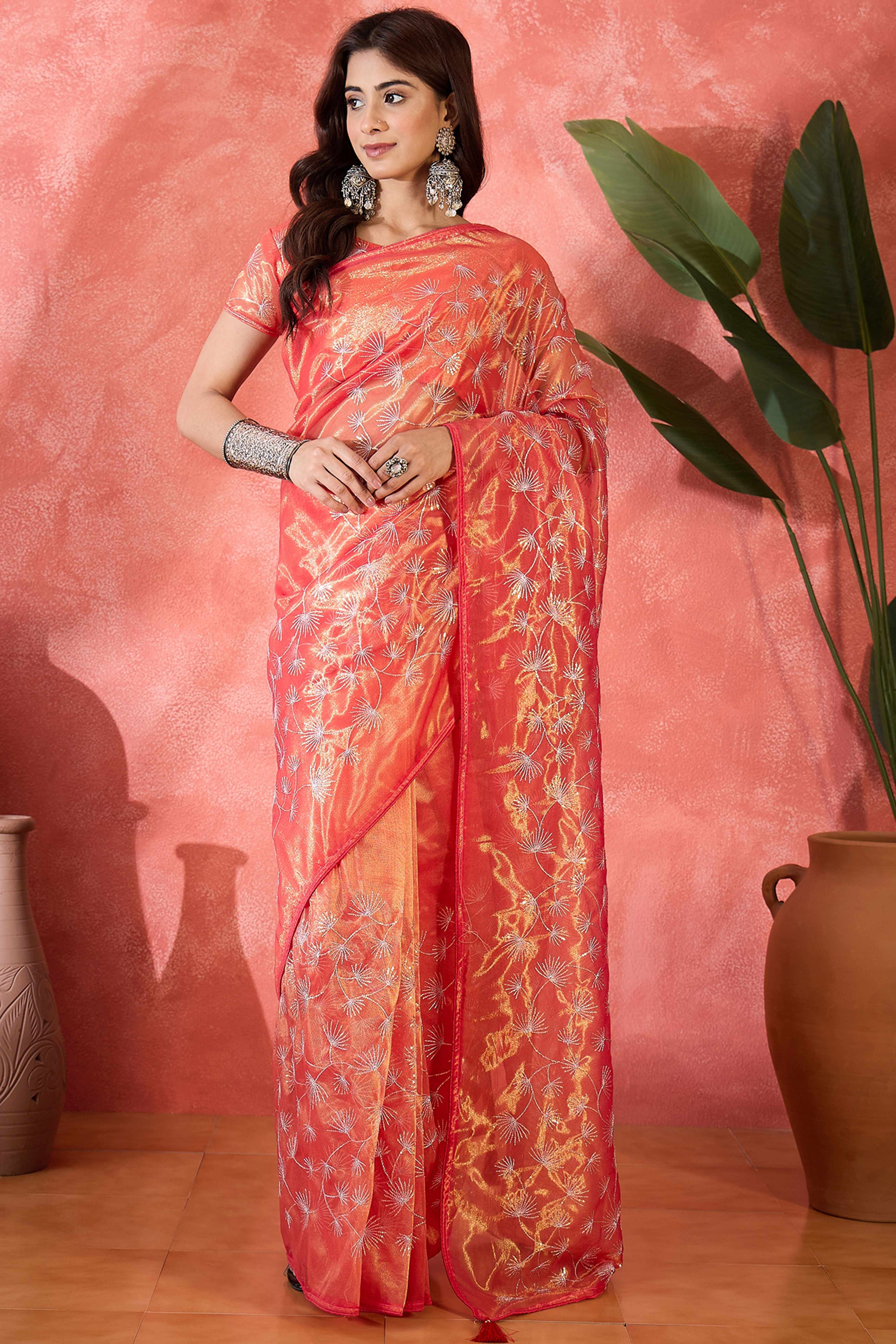 Rust Orange Twill Net Saree With Intricate Floral Sequin Work & Flowing Tassel Pallu