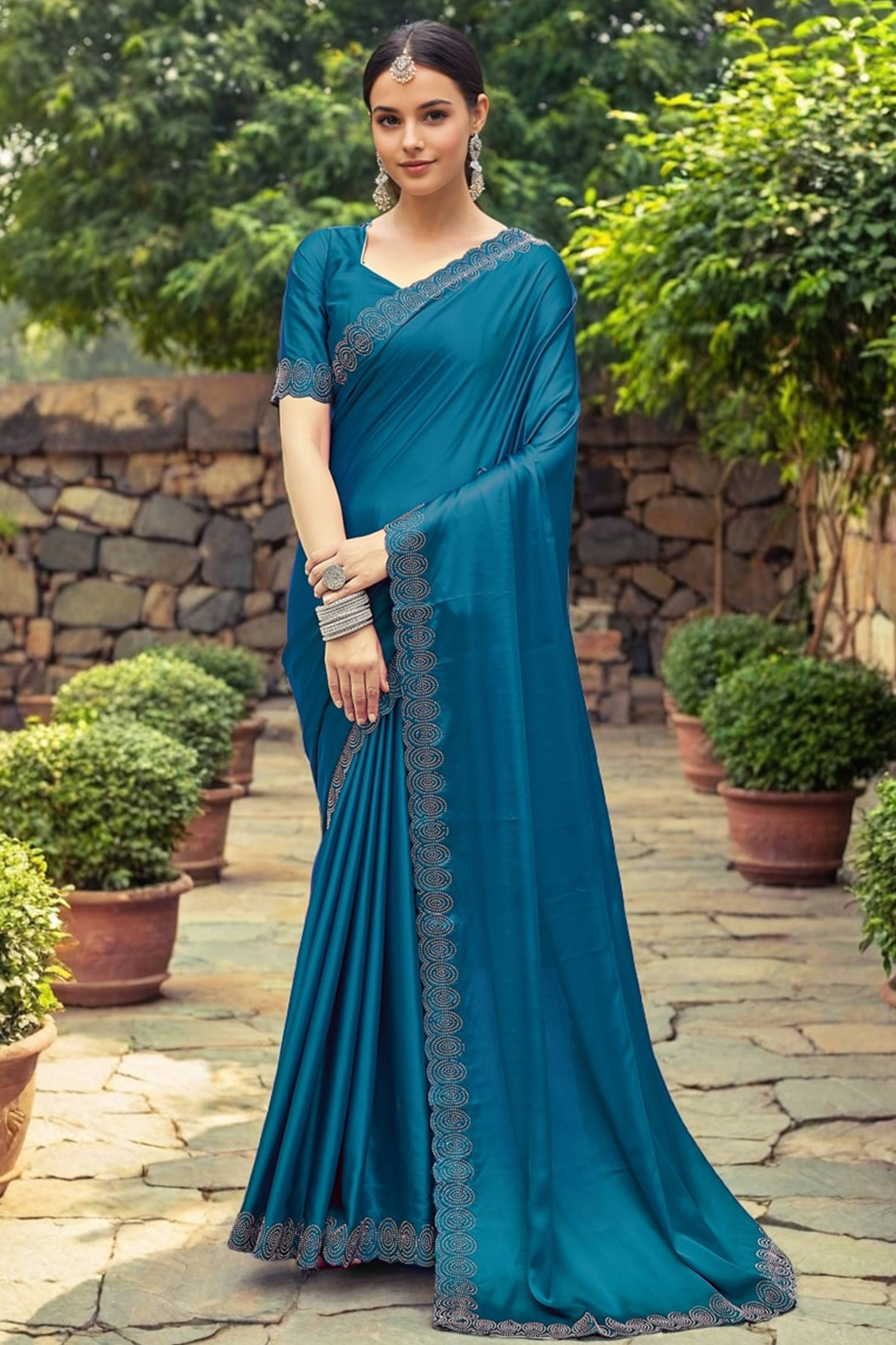 Teal Blue Solid Rangoli Dola Silk Saree Featuring Sparkling Swarovski Work Border