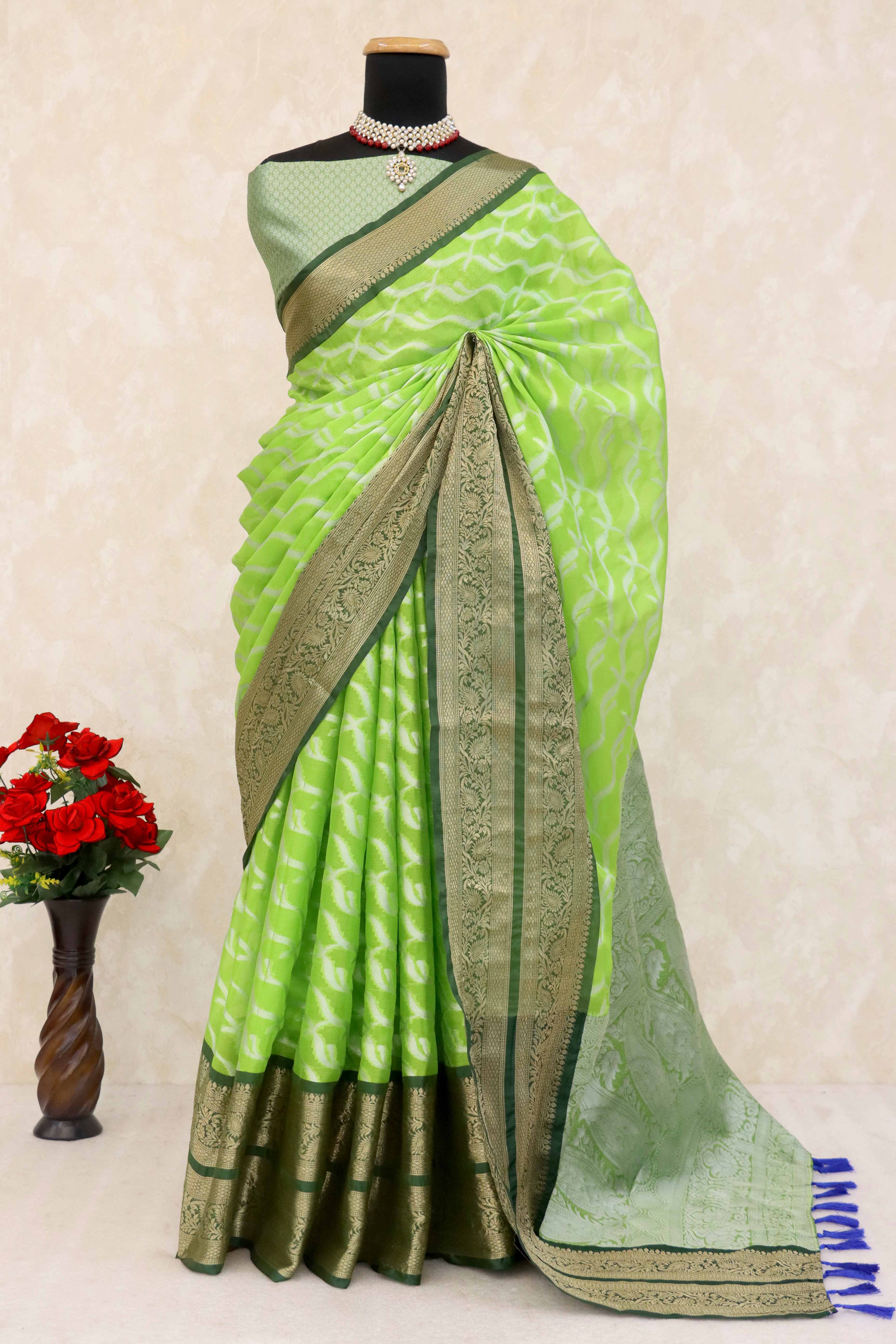 Parrrot Green Kanjivaram Silk Saree Adorned With Zari Weaving & Graceful Tassels