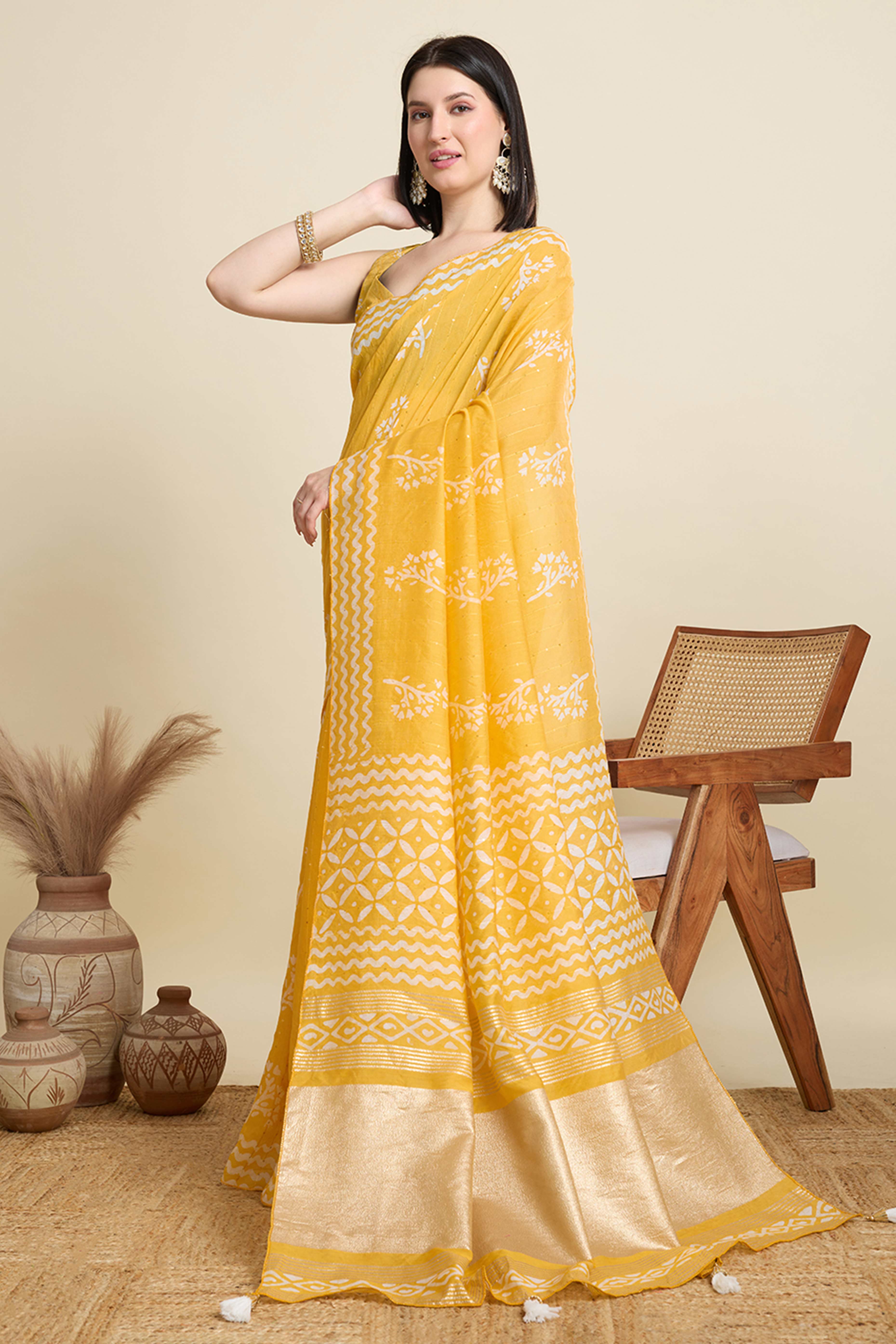 Yellow Cotton Blend Saree Featuring Floral Prints and Elegant Sequins Work Accents