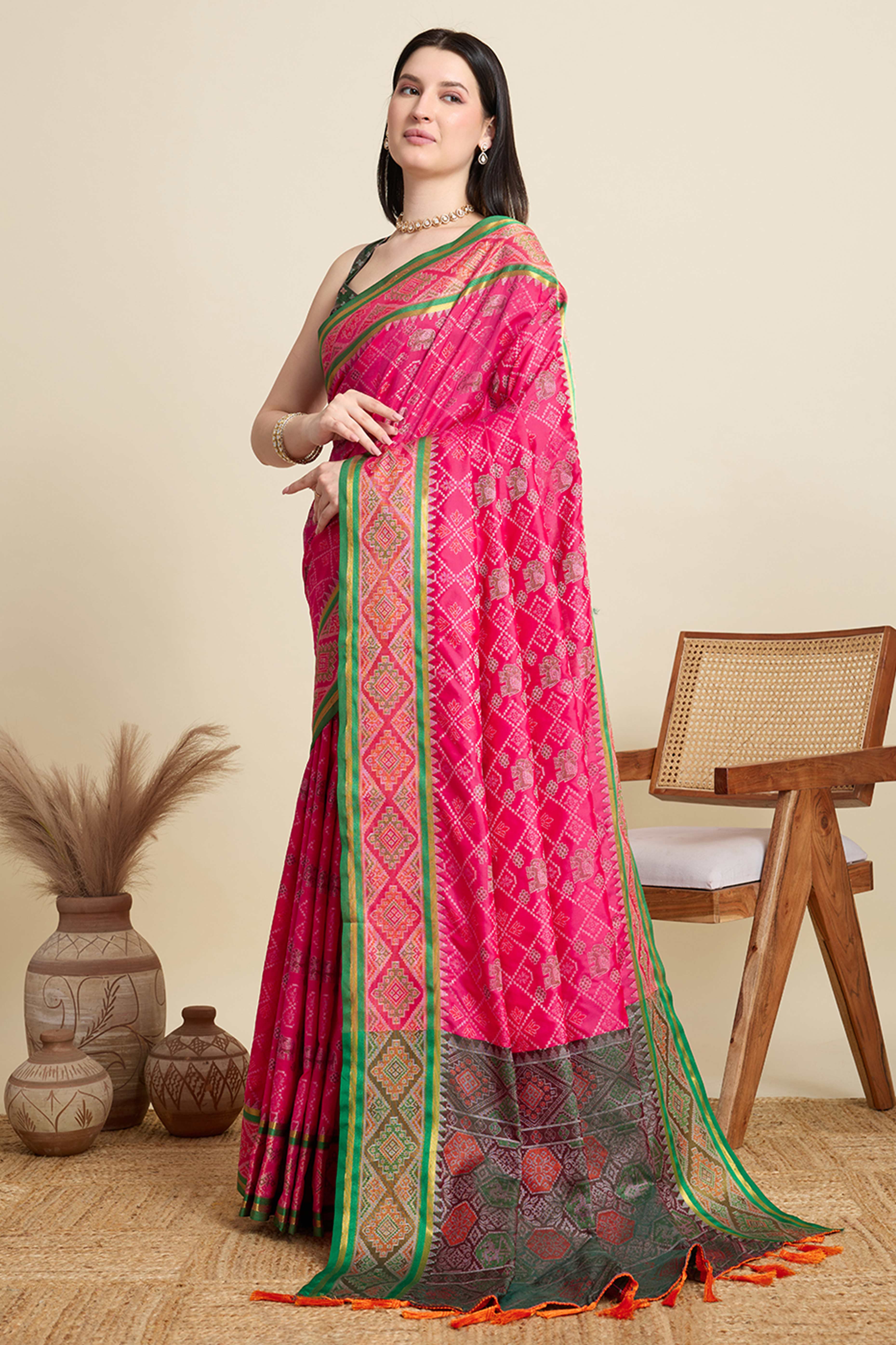 Pink Silk Blend Saree Featuring Patola Prints and a Detailed Weaving Border