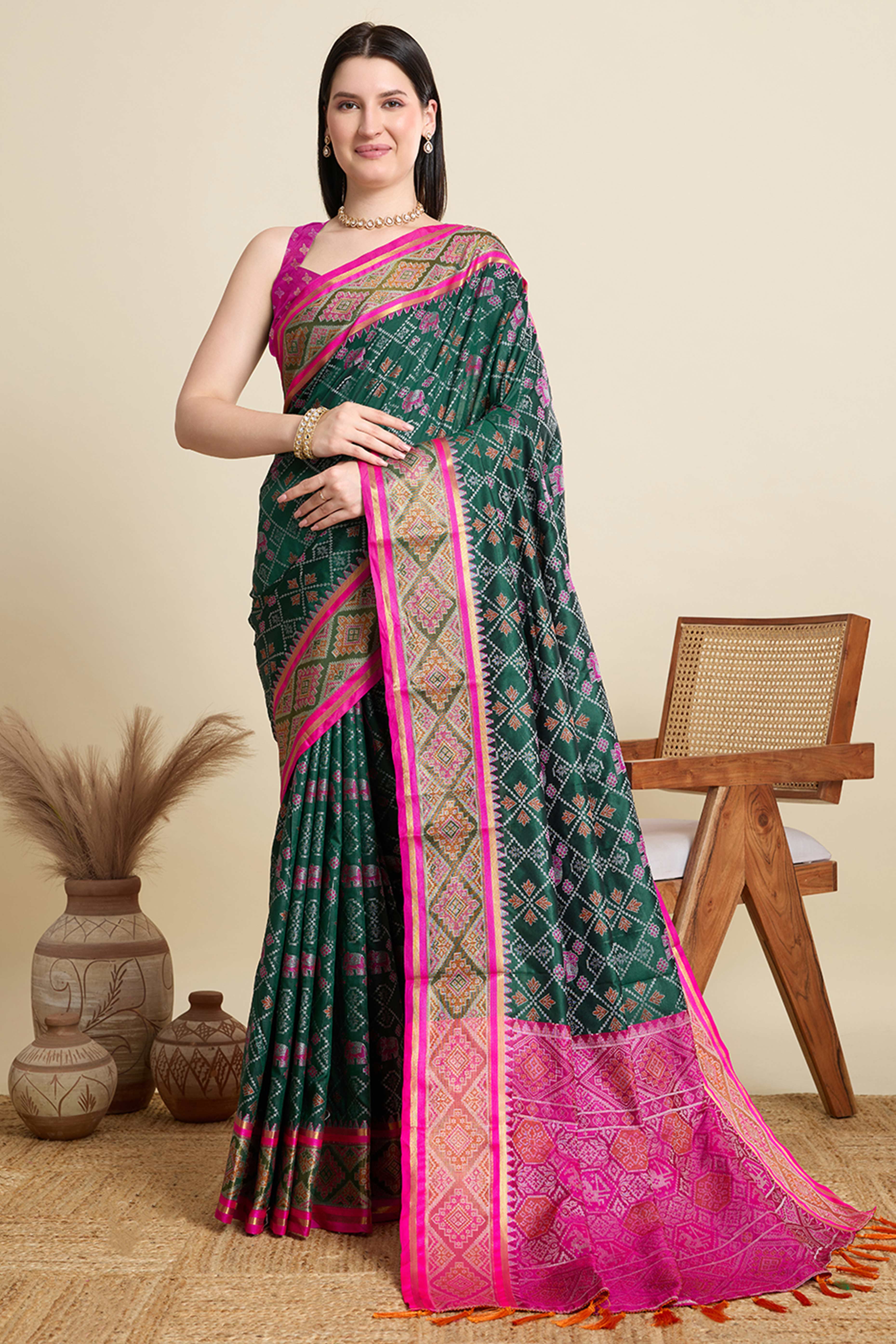 Green Silk Blend Saree Featuring Patola Prints and a Detailed Weaving Border