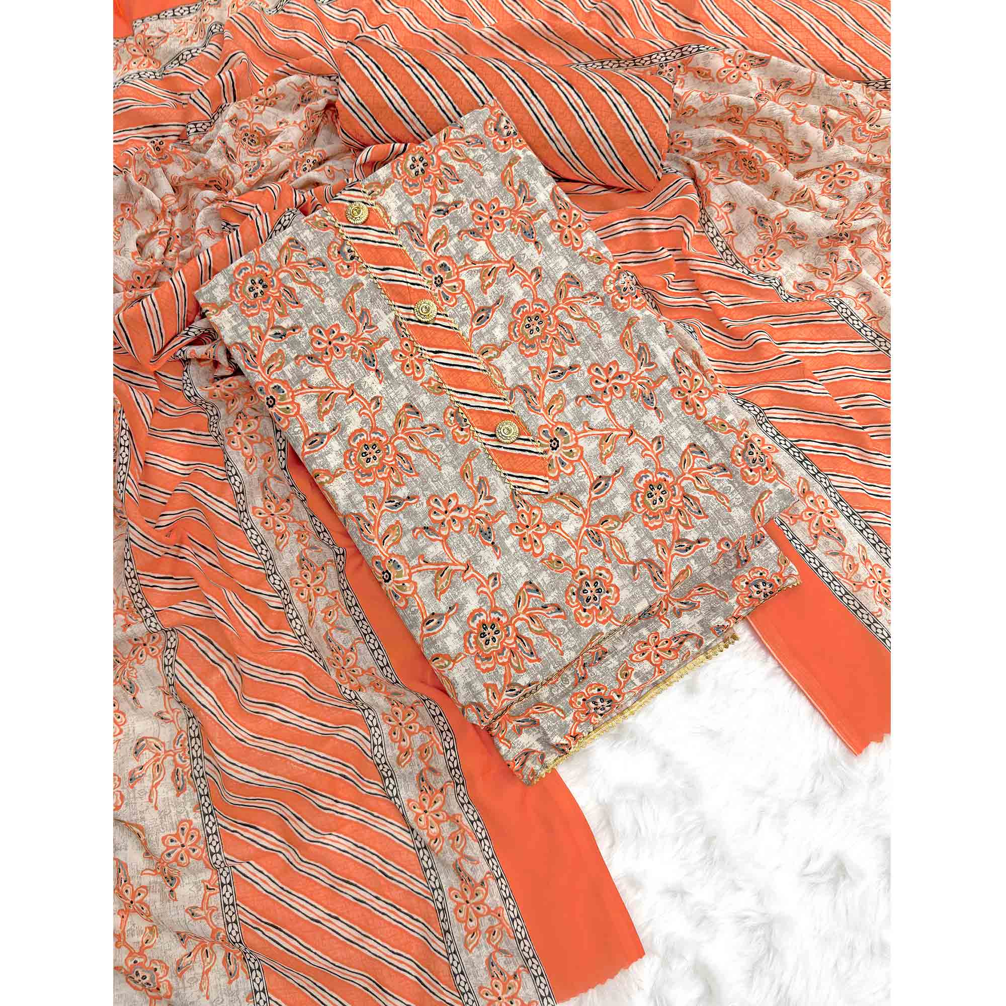 Charming Orange Floral Printed Cotton Blend Dress Material Featuring Intricate Lace Border
