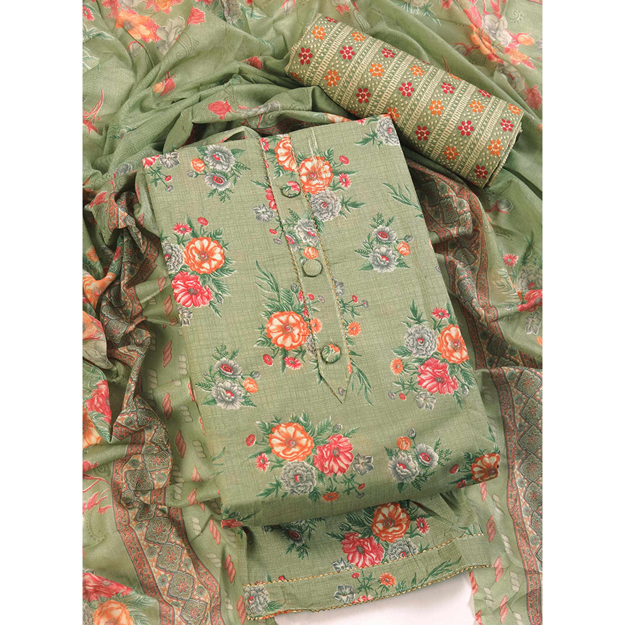 Charming Green Dress Material in Pure Cotton with Subtle Floral Pattern Work