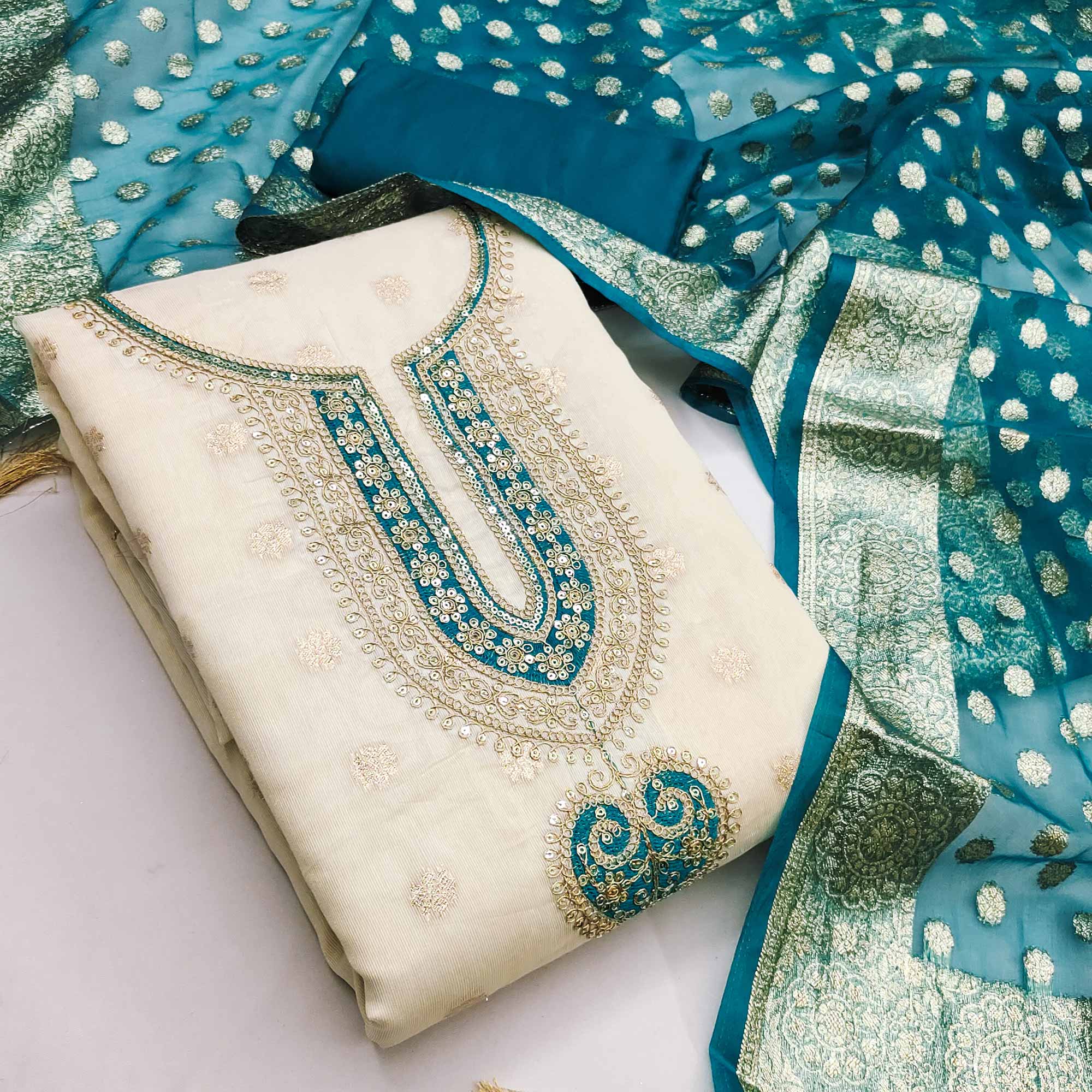 Graceful Cream & Morpich Butti Weaving Shimmer Dress Material Adorned With Cording Embroidery Work