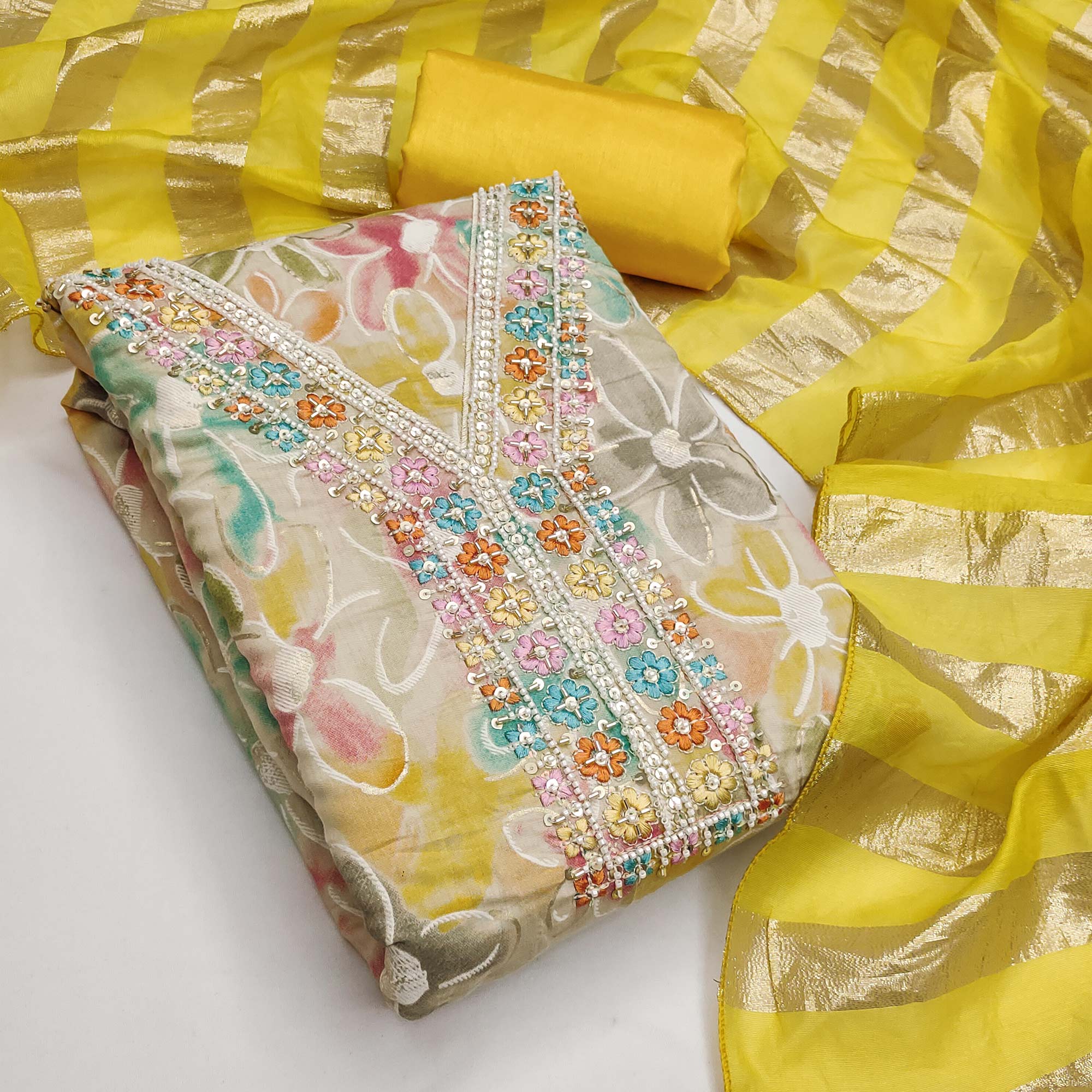 Vibrant Yellow Floral Printed Roman Art Silk Dress Material Adorned With Sparkling Beads & Sequins