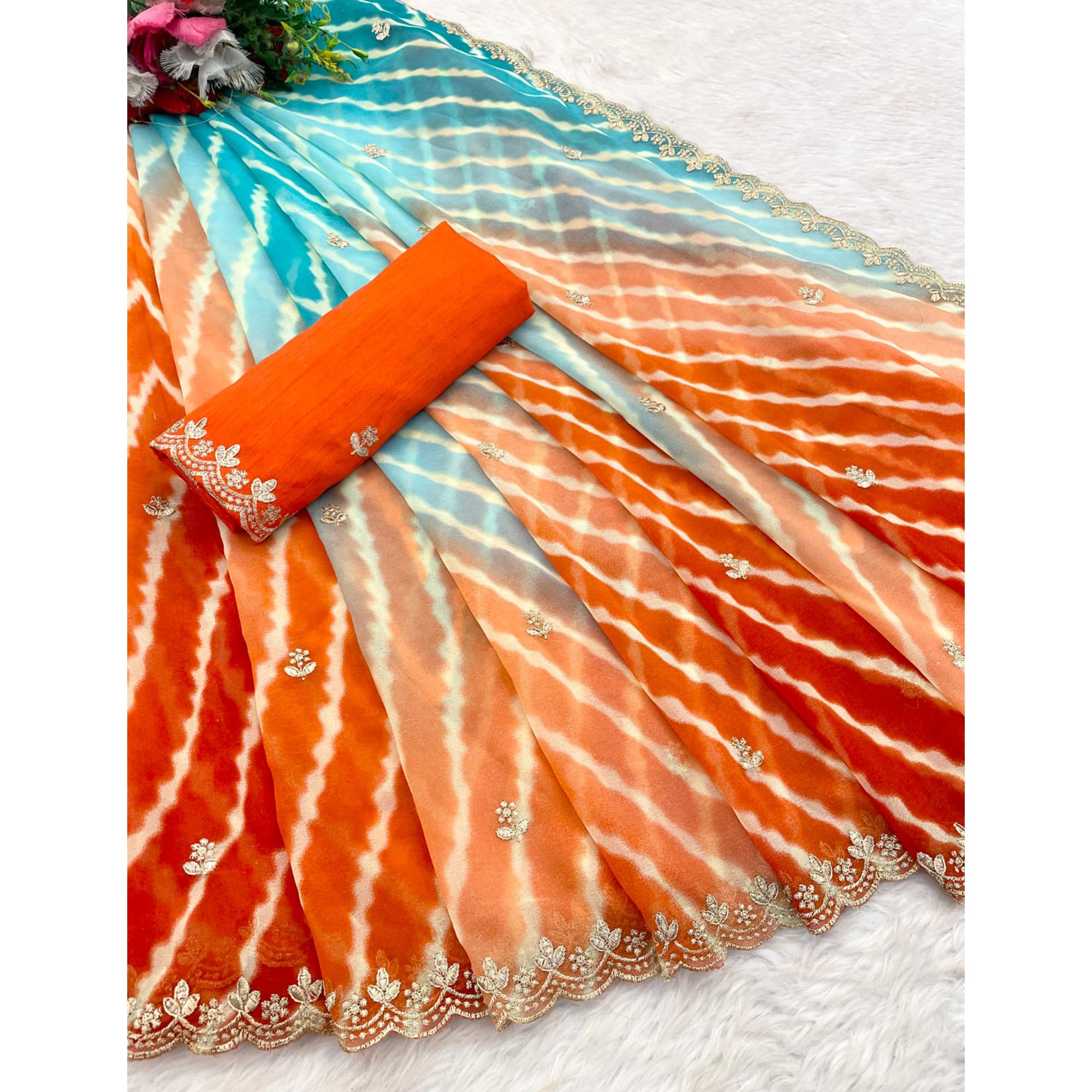 Festive Georgette Saree in Orange & Blue with Ethnic Leheriya Print and Fine Embroidery