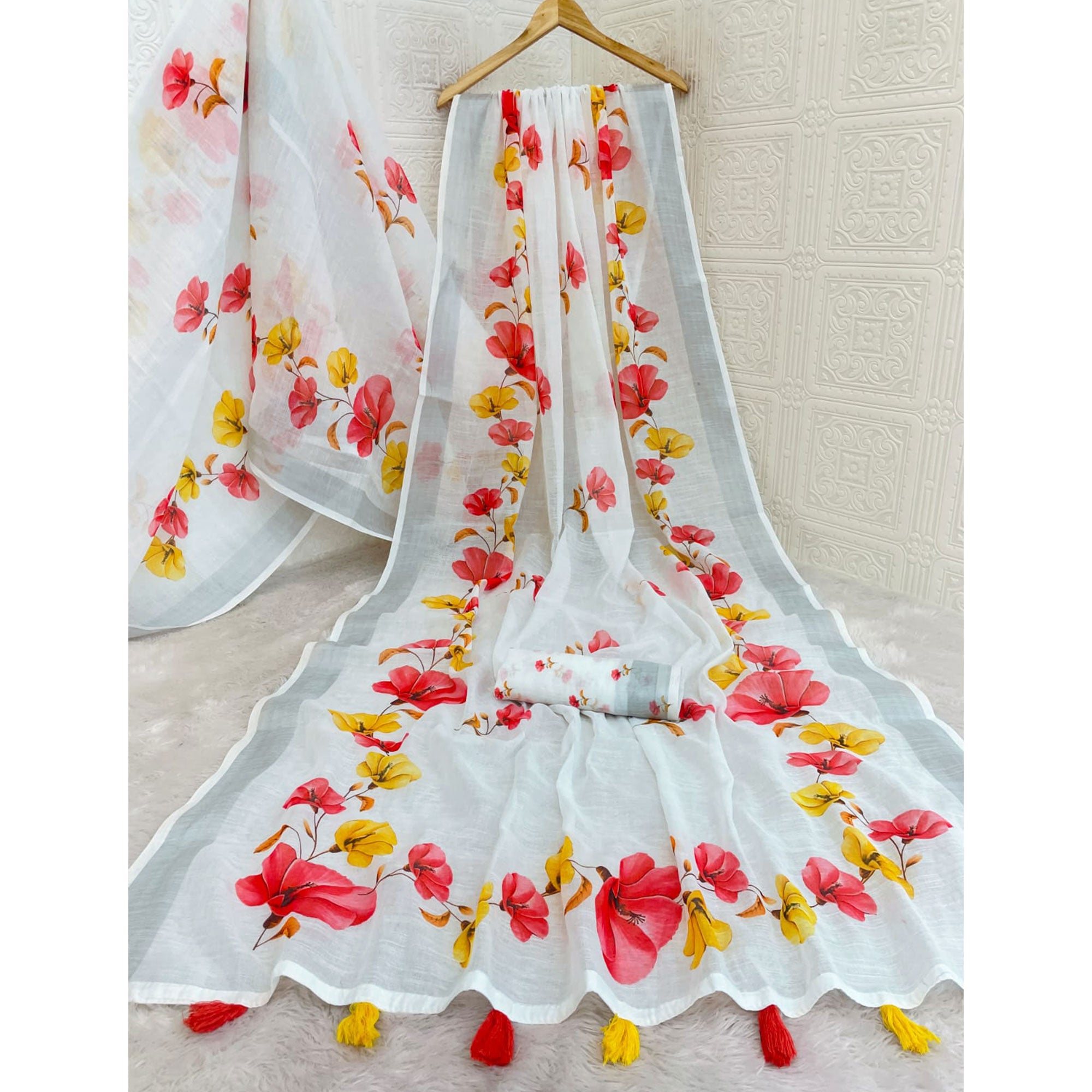 Elegant White Floral Printed Linen Cotton Saree With Delicate Tassel Detailing