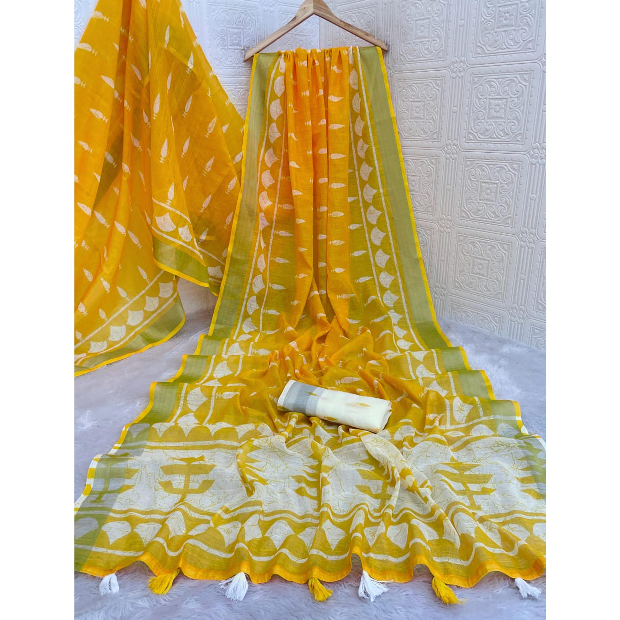 Vibrant Yellow Printed Linen Cotton Saree Featuring Artistic Tassel Detailing