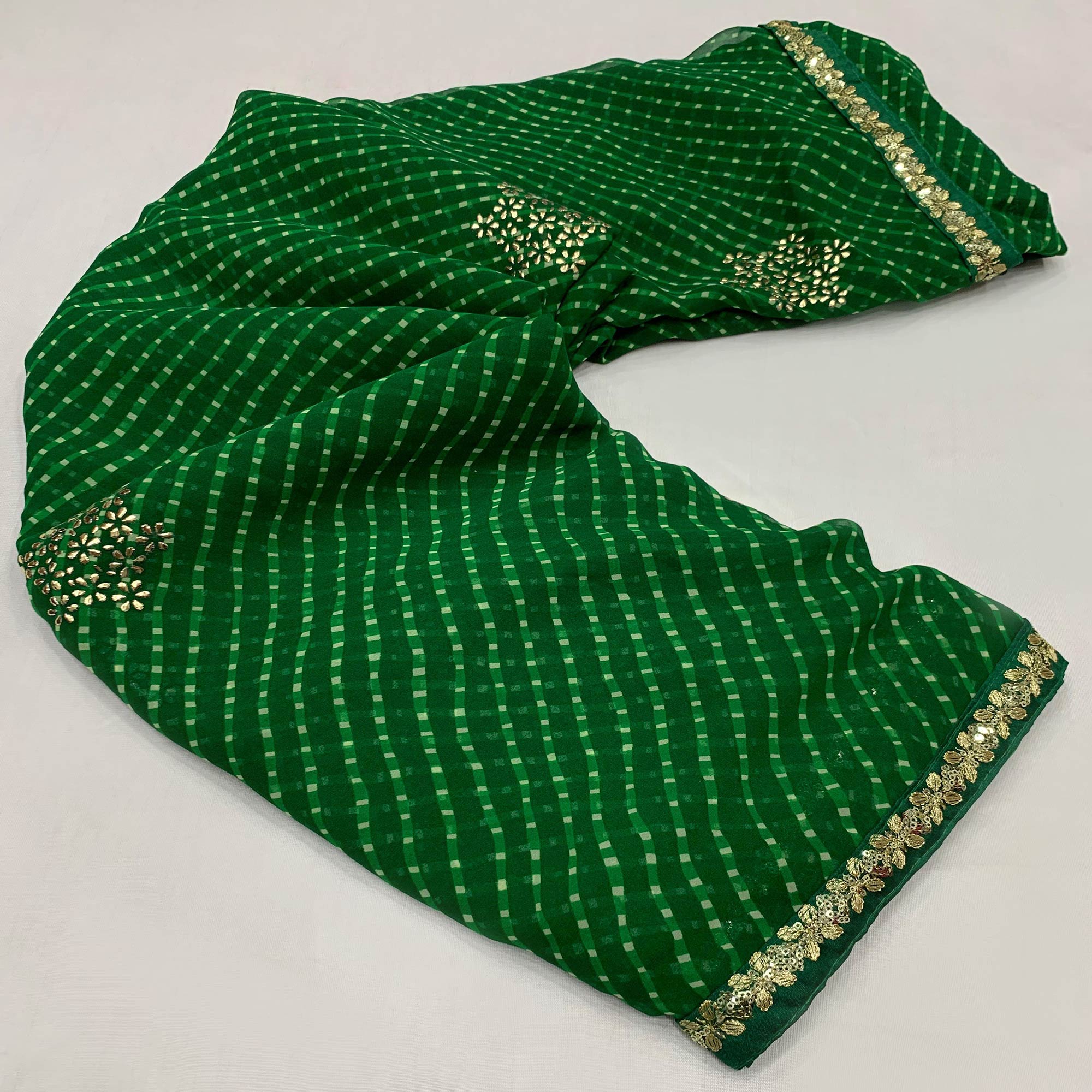 Dark Green Printed Georgette Saree With lace Border