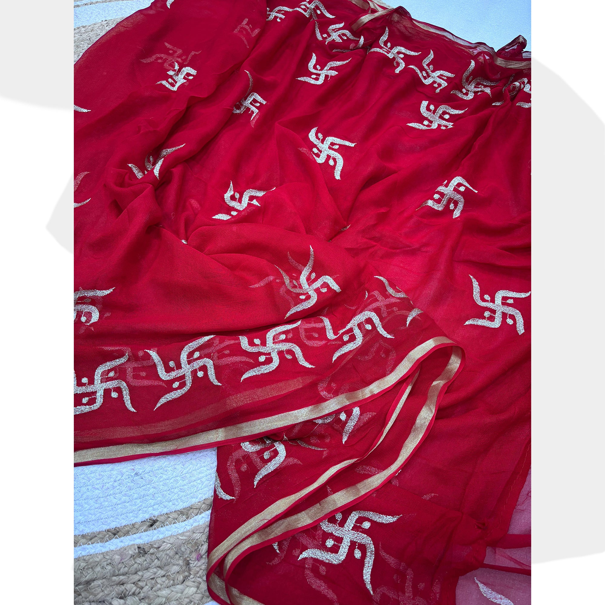 Festive Red Georgette Saree Enhanced with Fine Swastik Embroidered Motifs