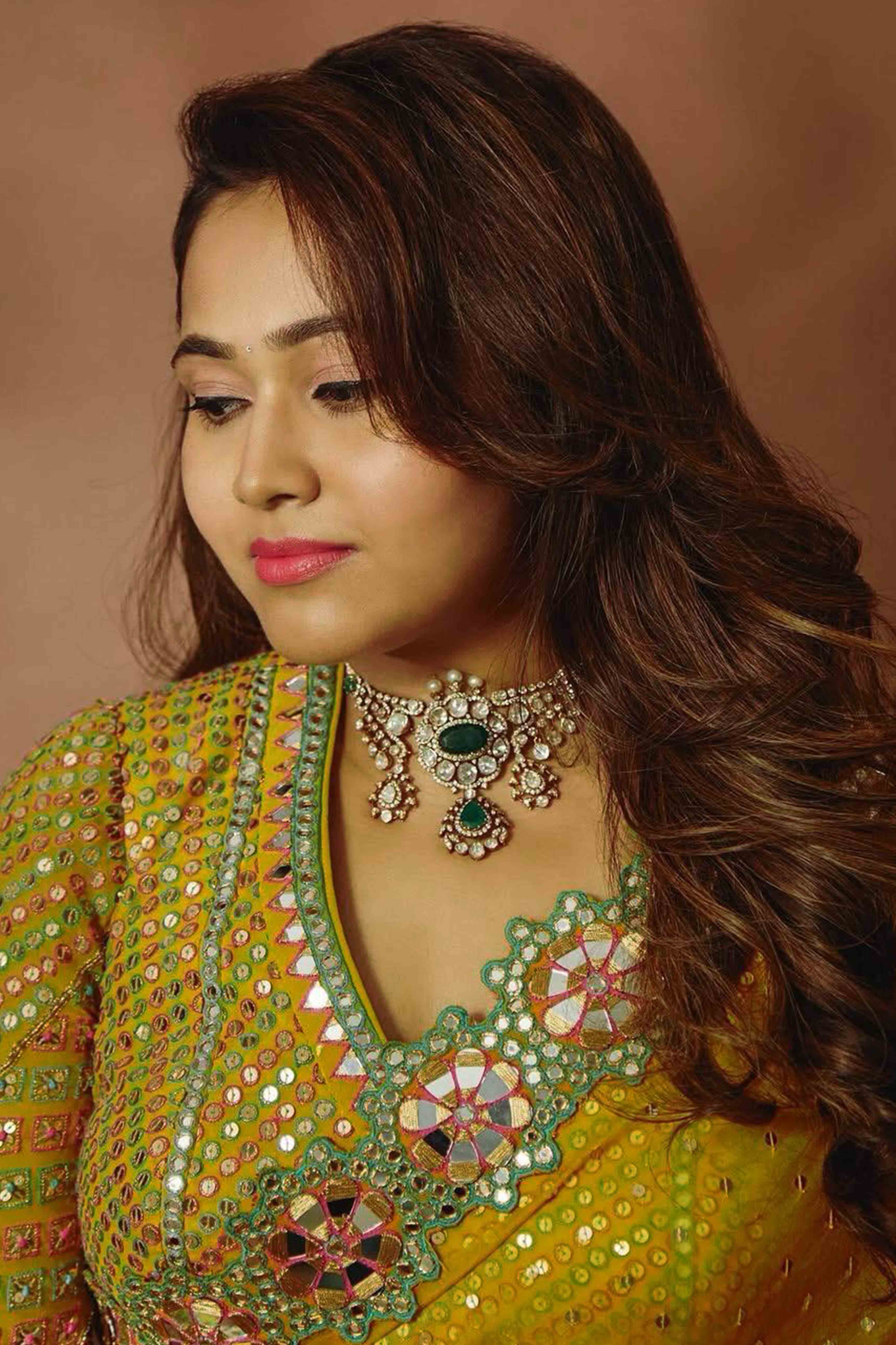 Embroidered Mustard Georgette Saree with Shimmering Mirror Accents